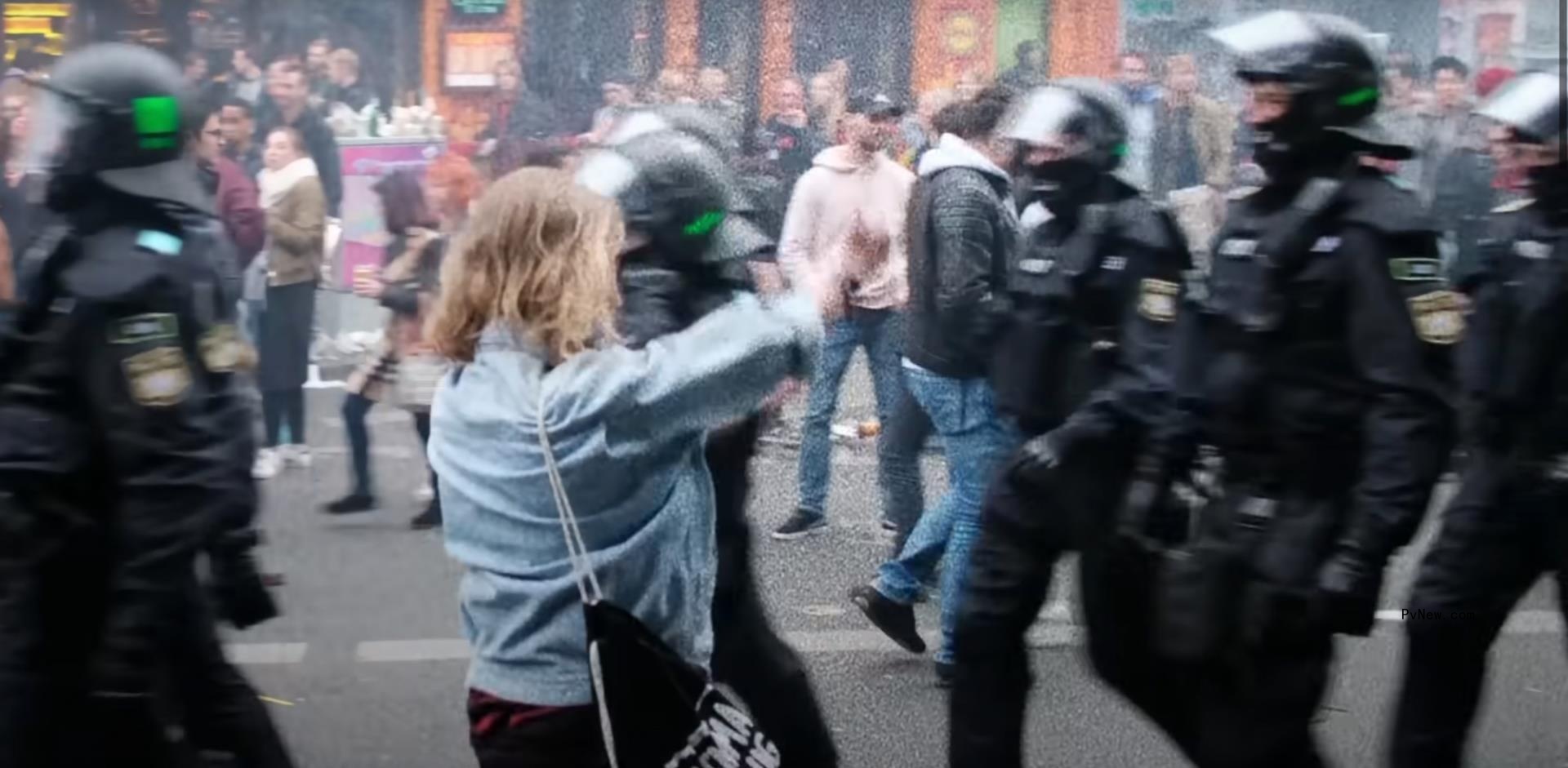 Protester flipping off police officers