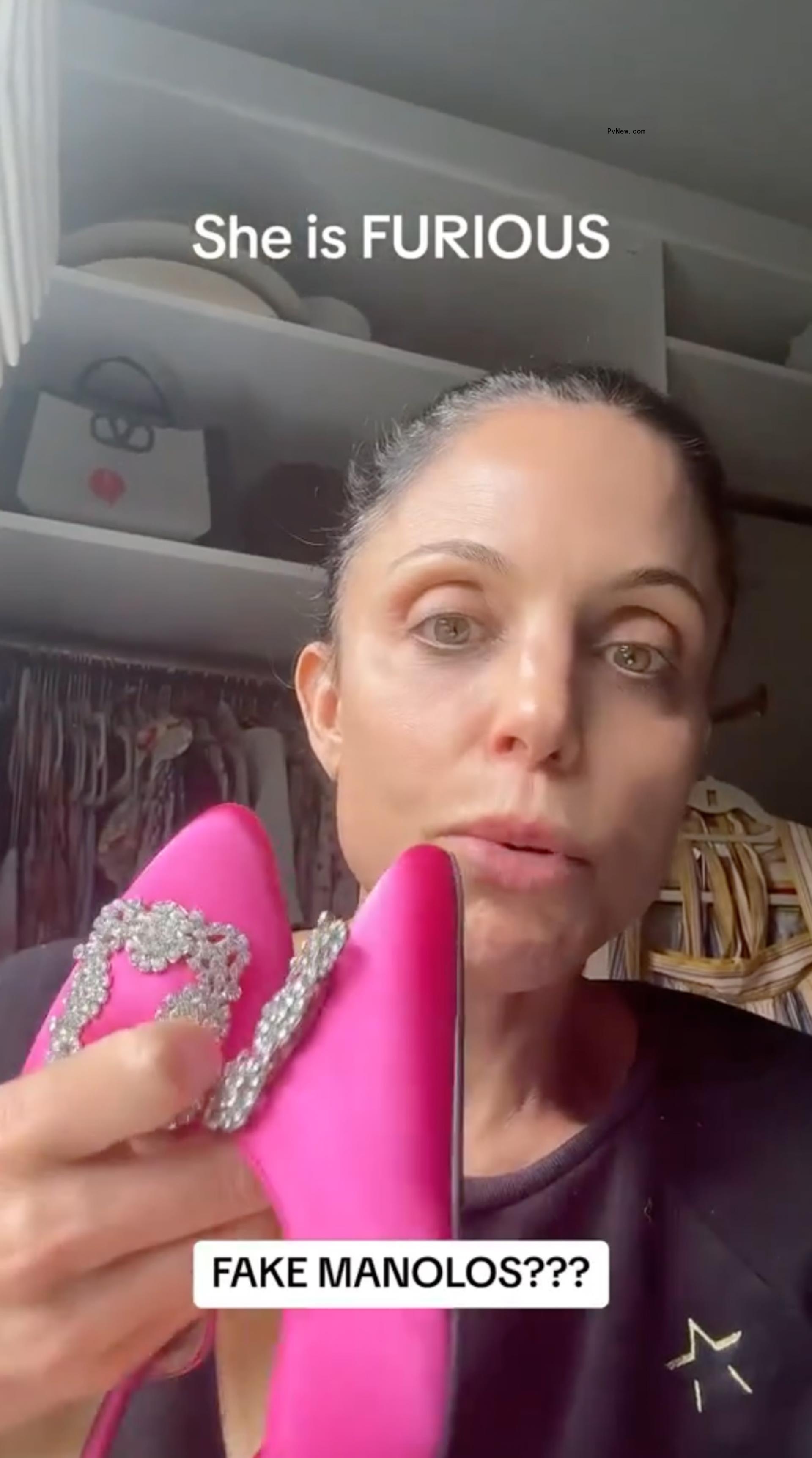 Bethenny Frankel holding pink heels.