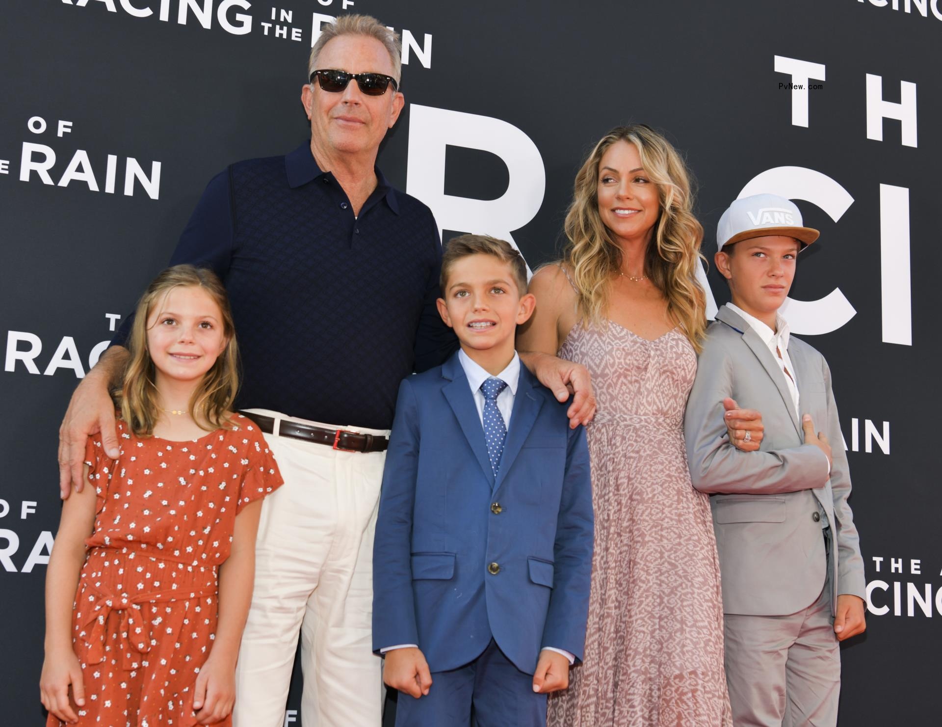 Christine Baumgartner and Kevin Costner with their kids.