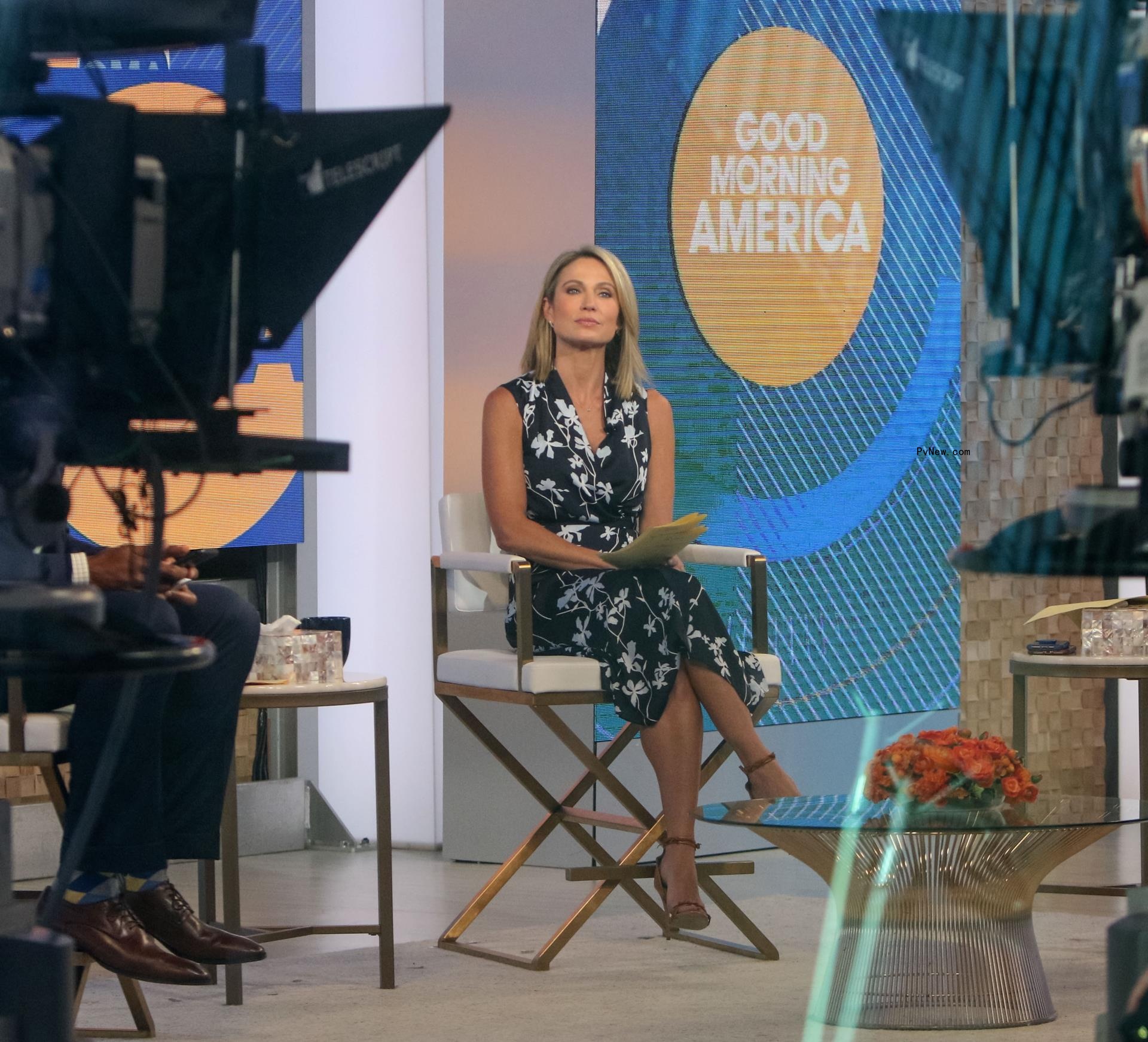 Amy Robach sitting on