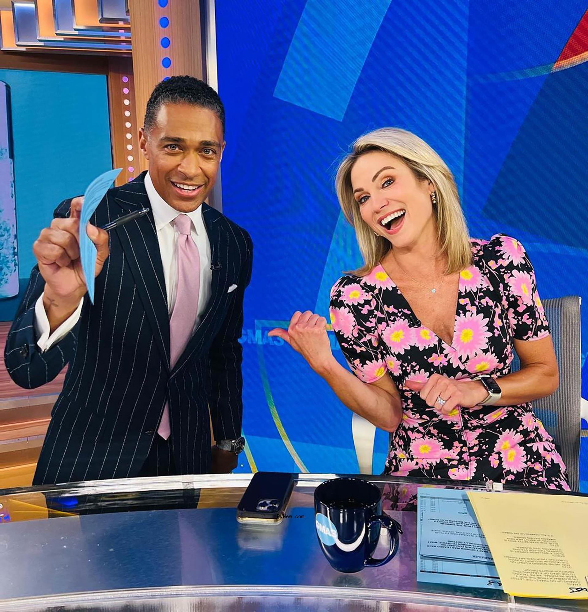 TJ Holmes and Amy Robach sitting on