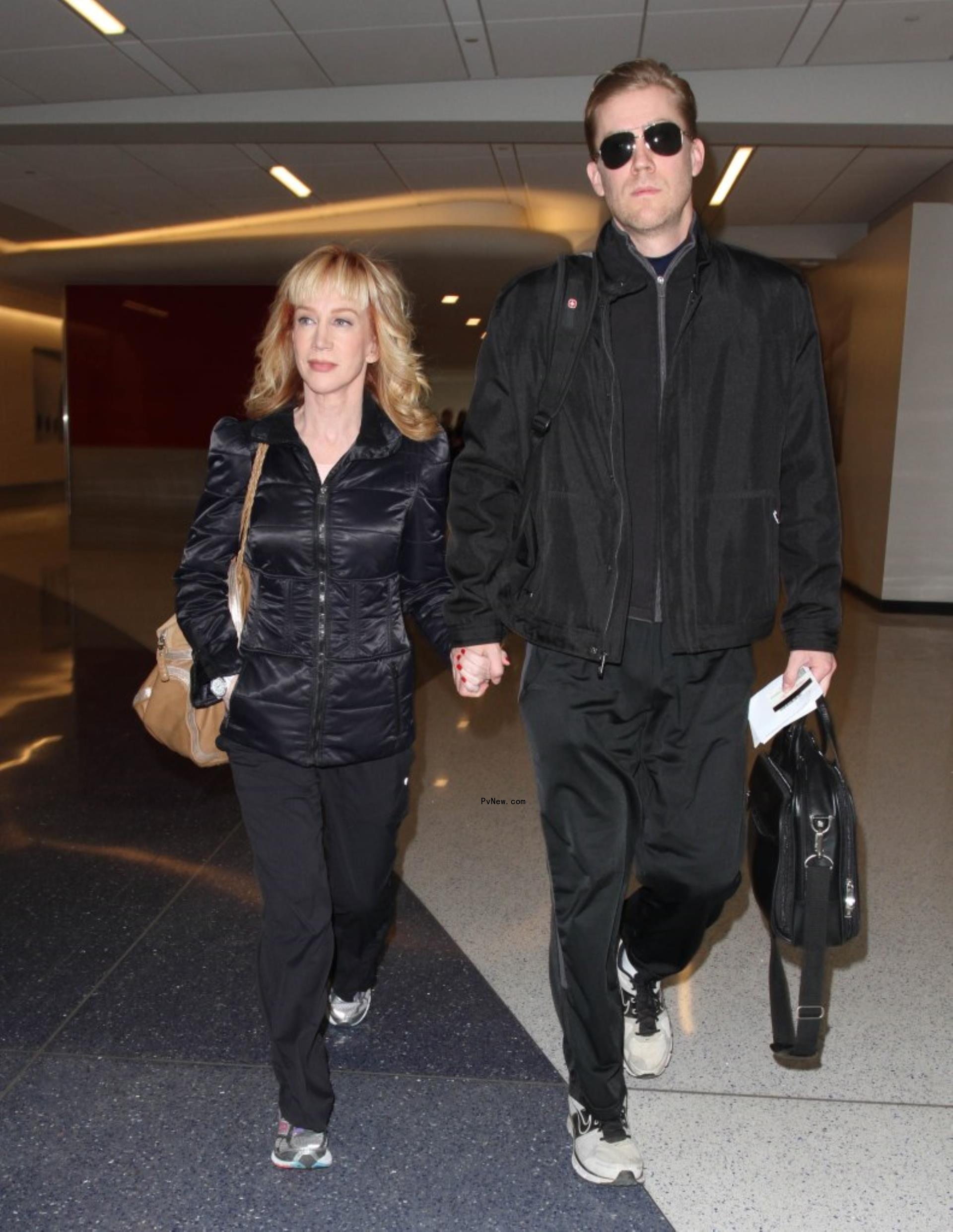 kathy griffin and randy bick holding hands and walking