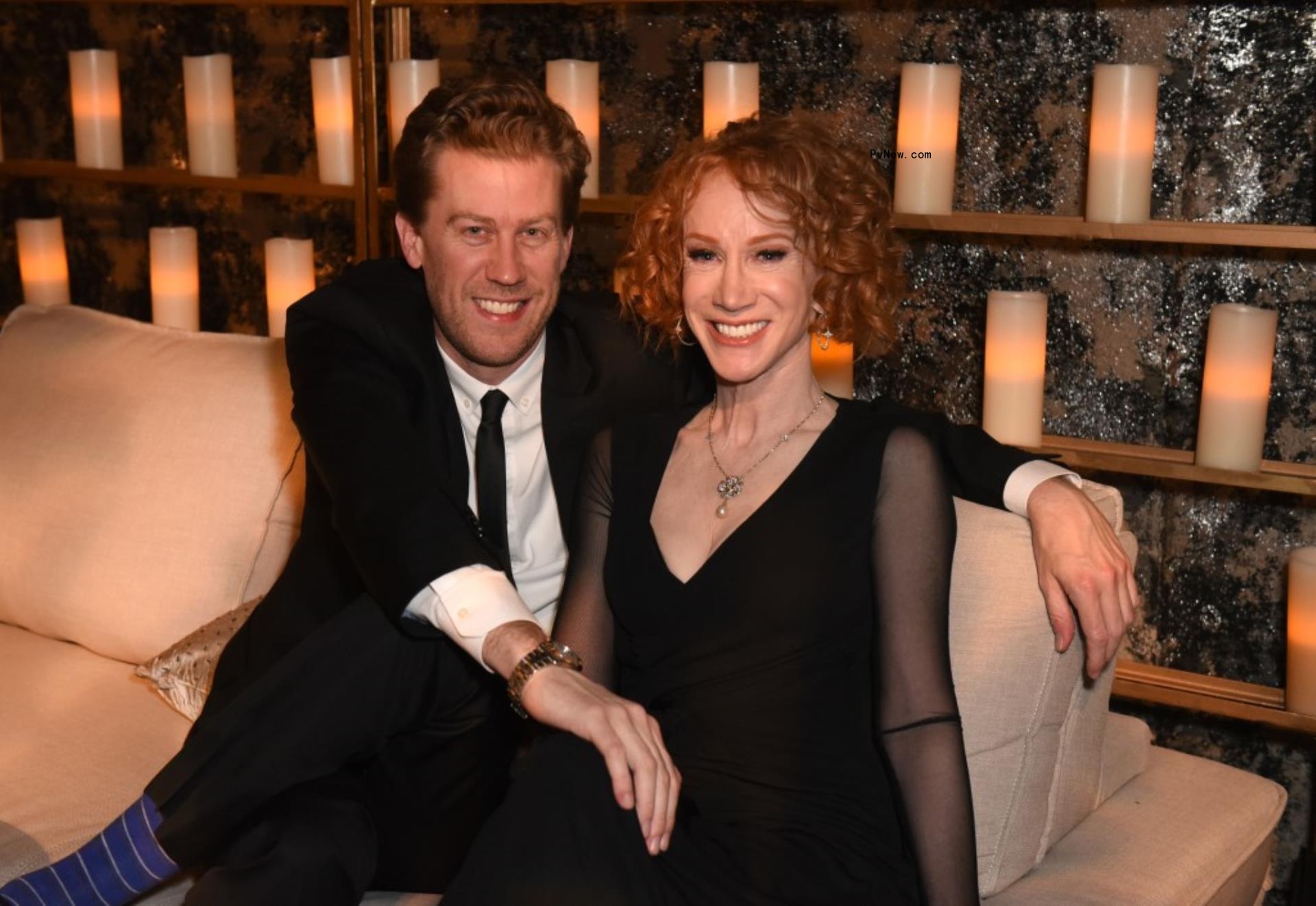 randy bick and kathy griffin sitting on a couch