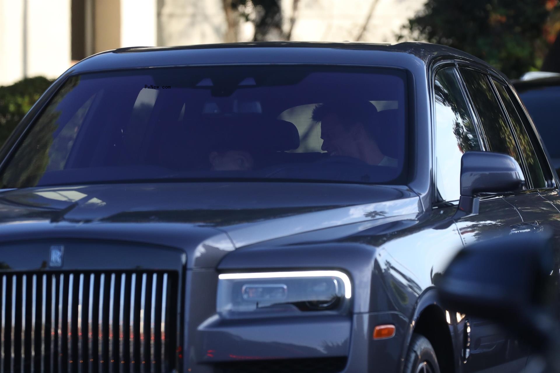 Tom Brady and Irina Shayk sitting in a car together