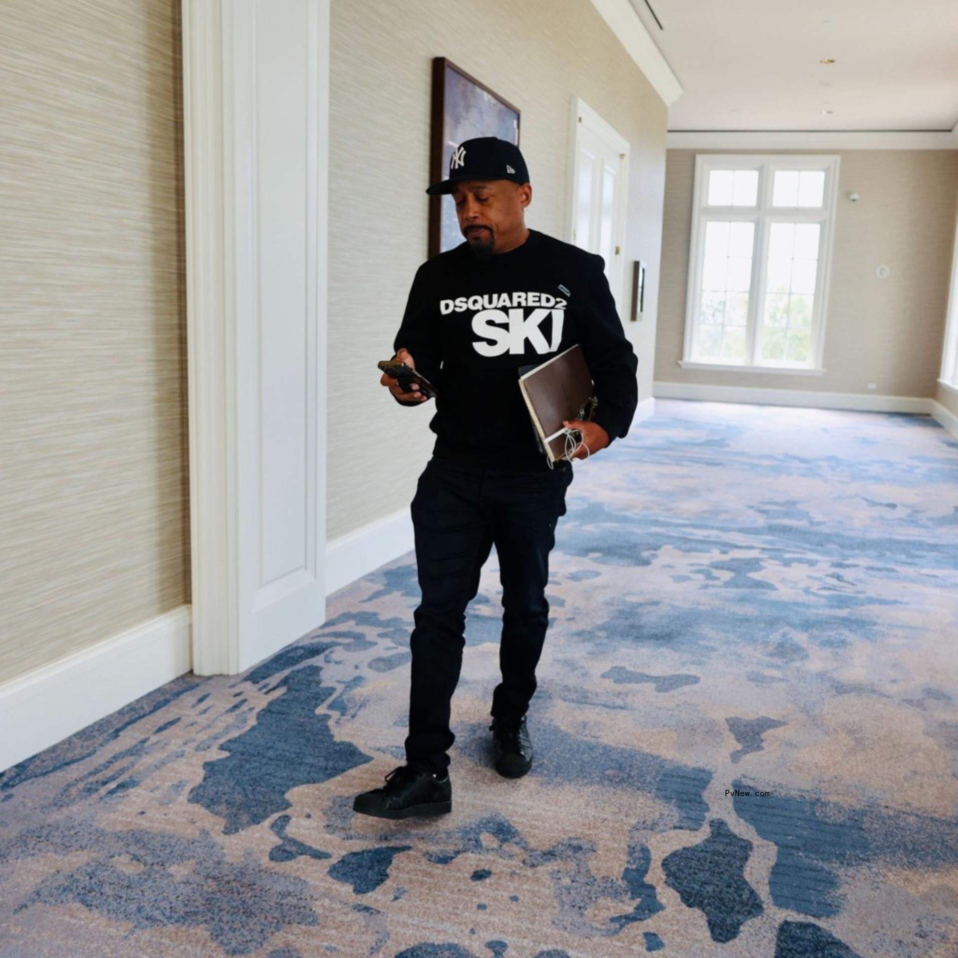 daymond john looking at his phone