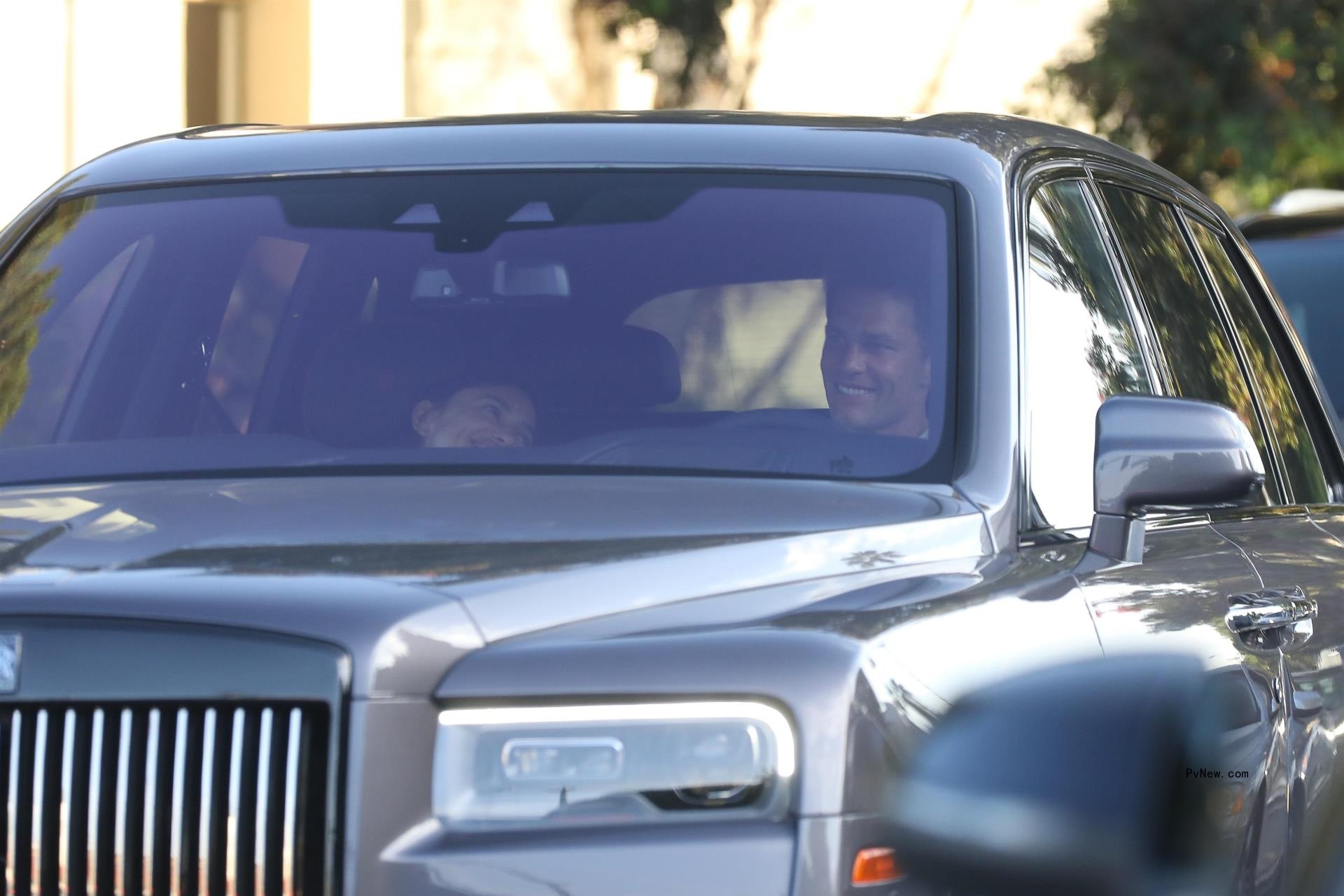 Tom Brady and Irina Shayk sitting in a car together