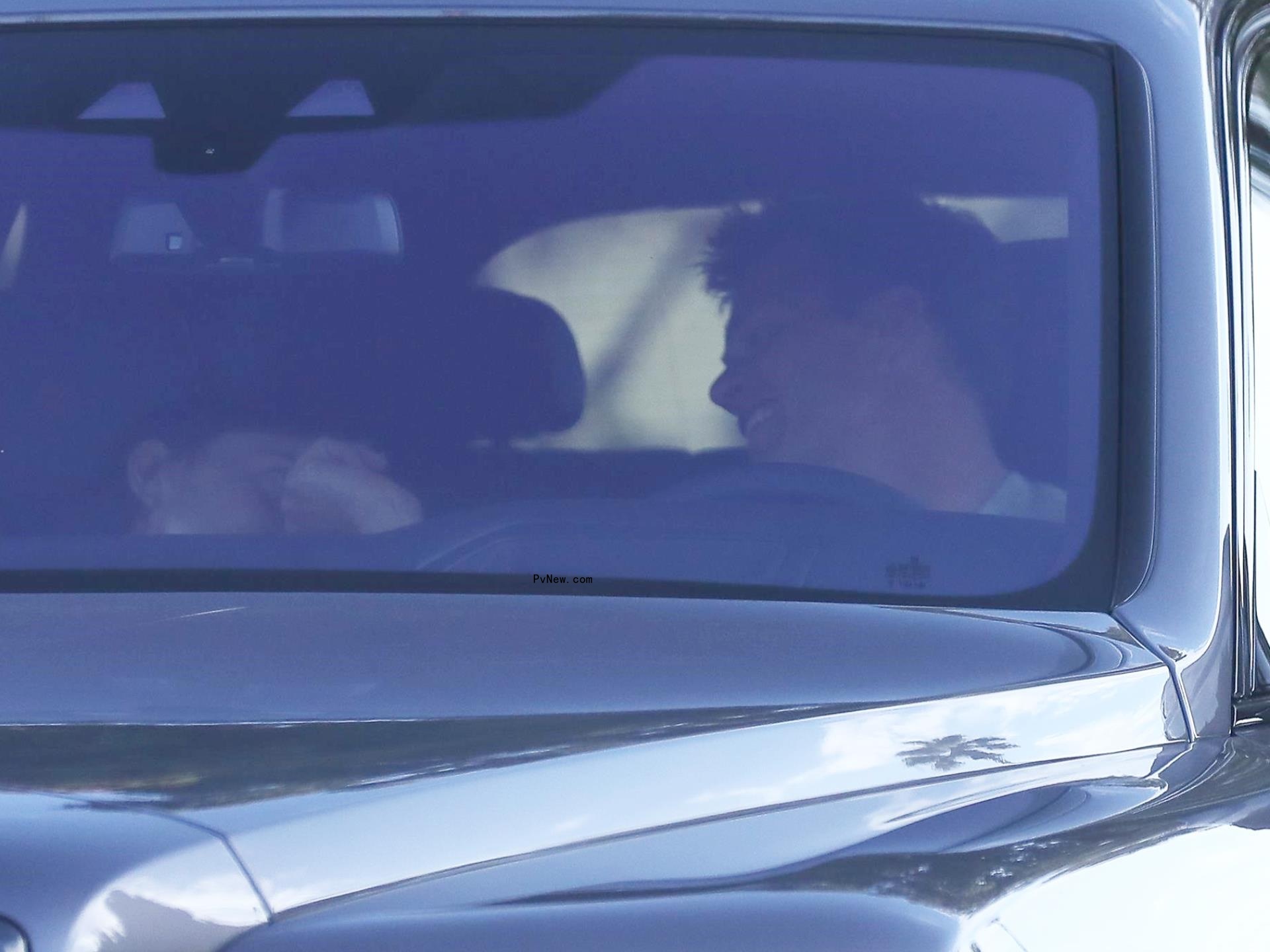 Irina Shayk and Tom Brady sitting in a car together