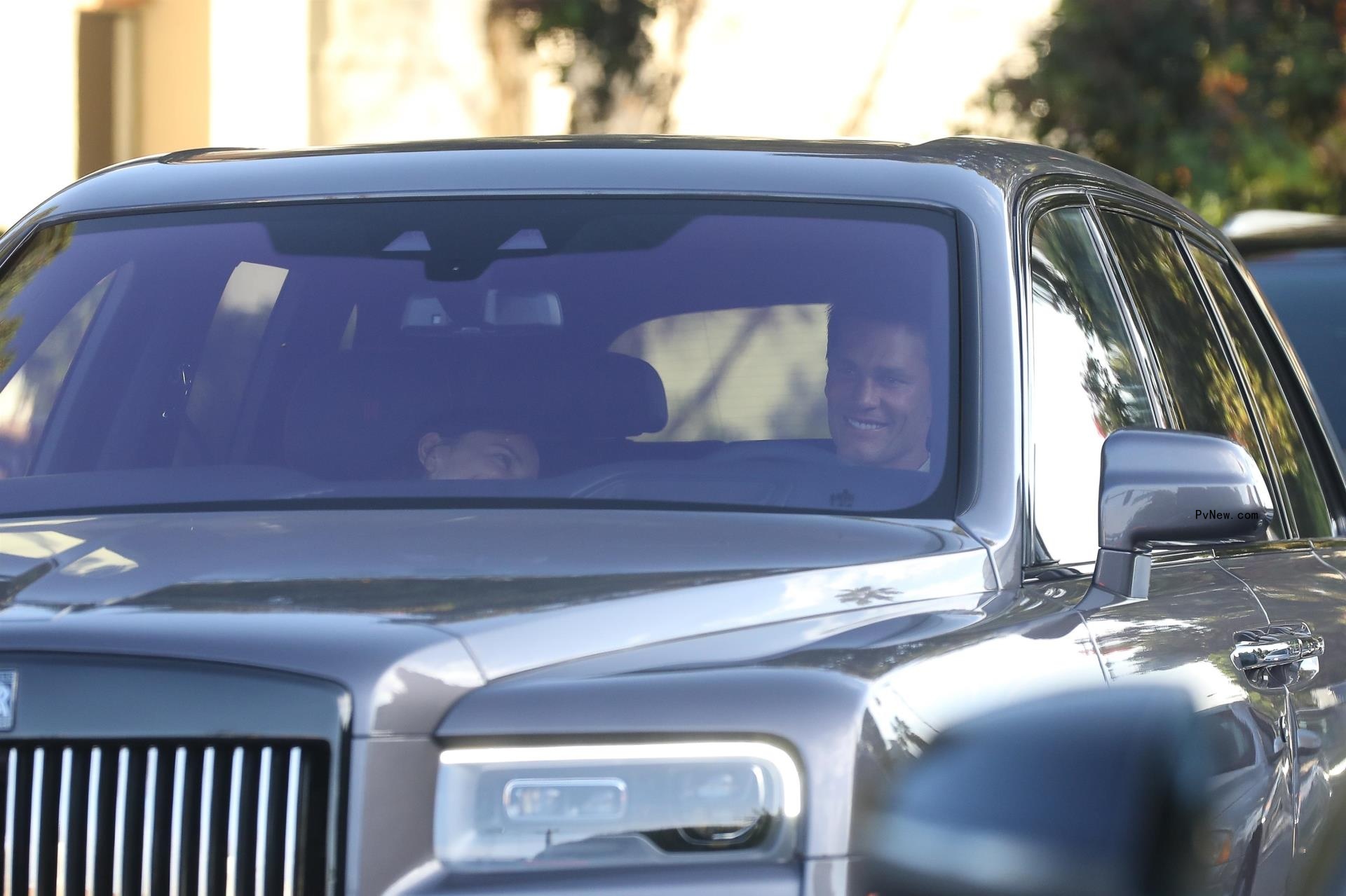 Irina Shayk and Tom Brady sitting in a car together