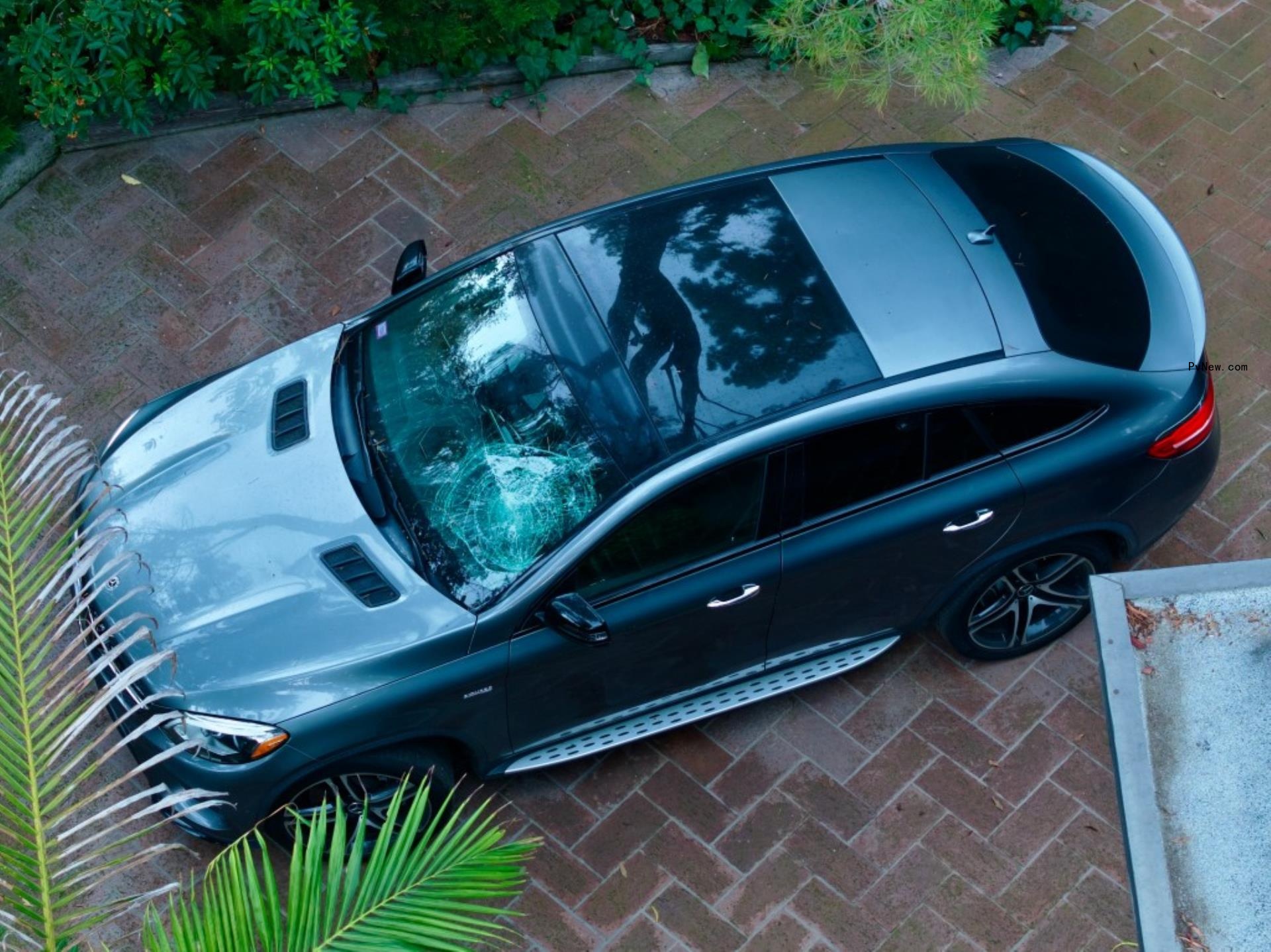 a mercedes-benz with a shattered windshield