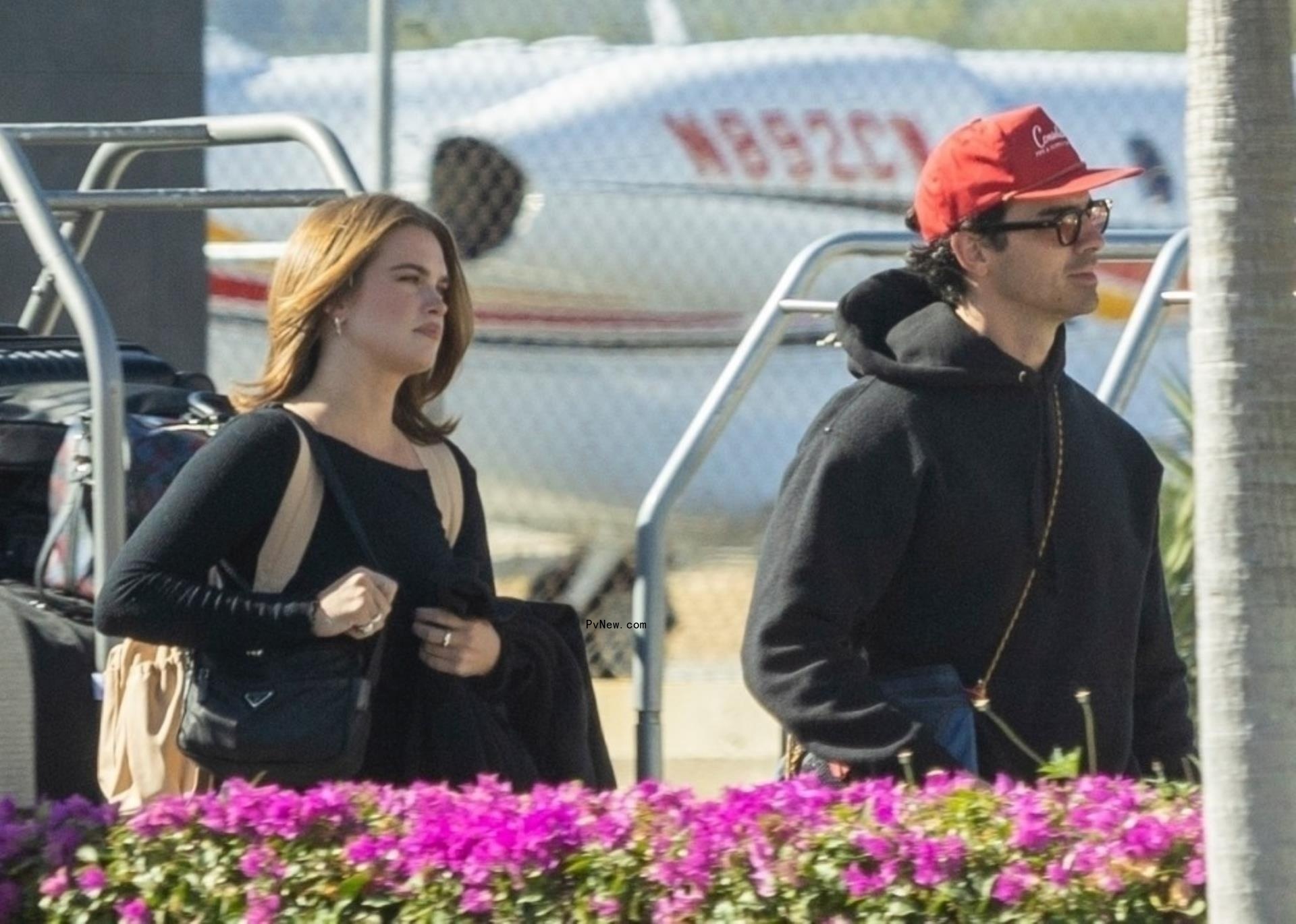 Joe Jo<i></i>nas and Stormi Bree at the airport in Cabo San Lucas.