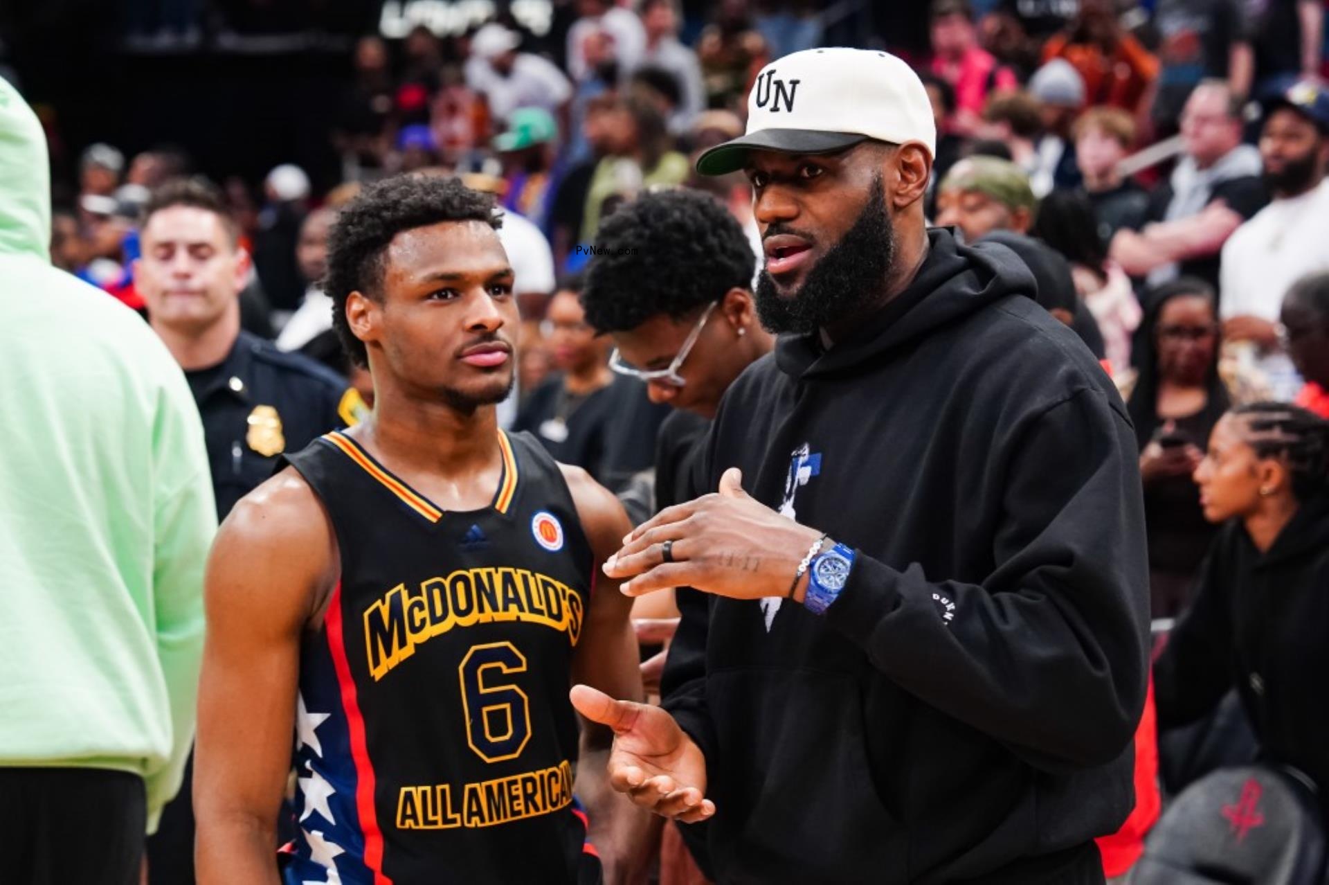 lebron james talking to his son bro<i></i>nny on the basketball court