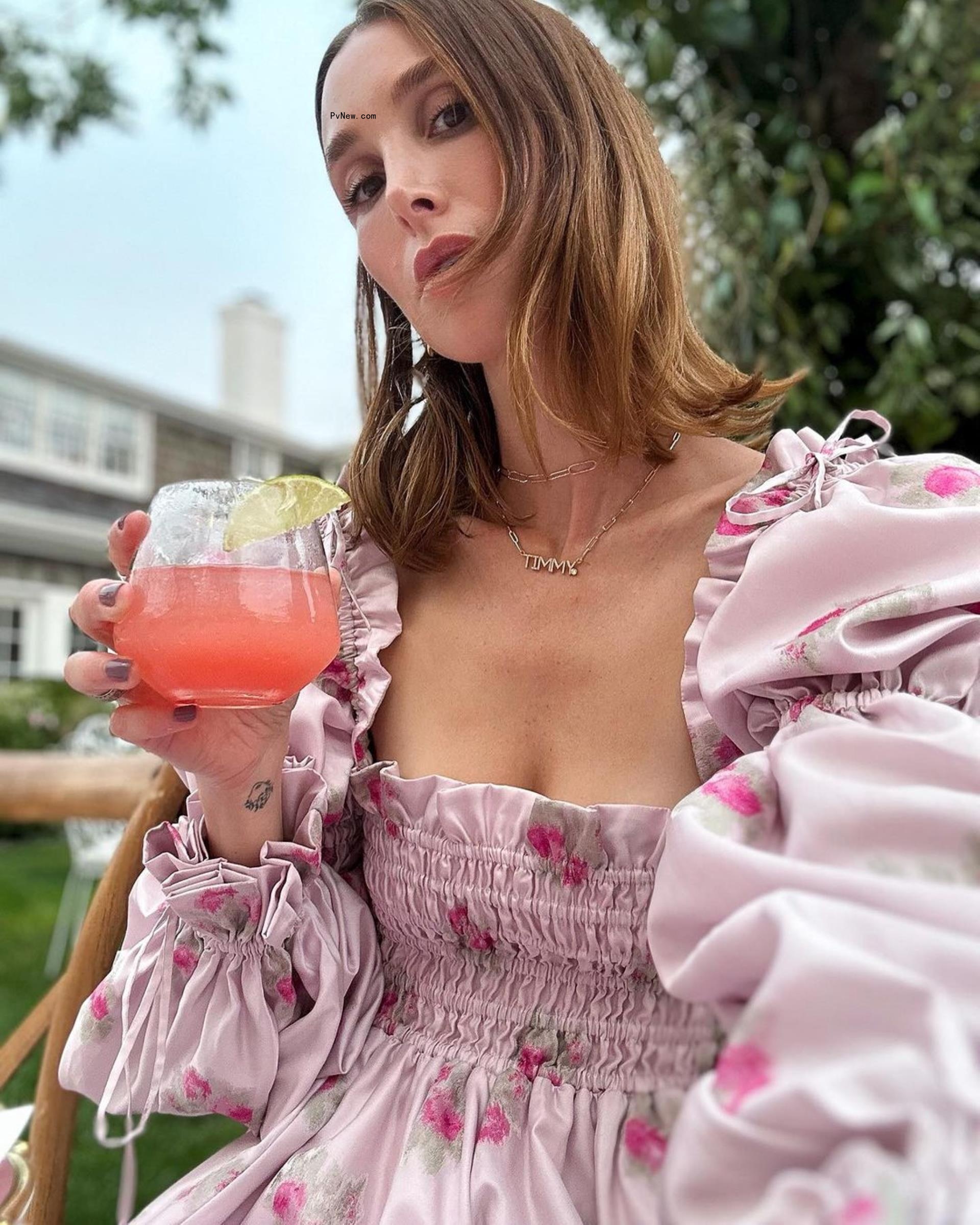 Whitney Port holding a cocktail.