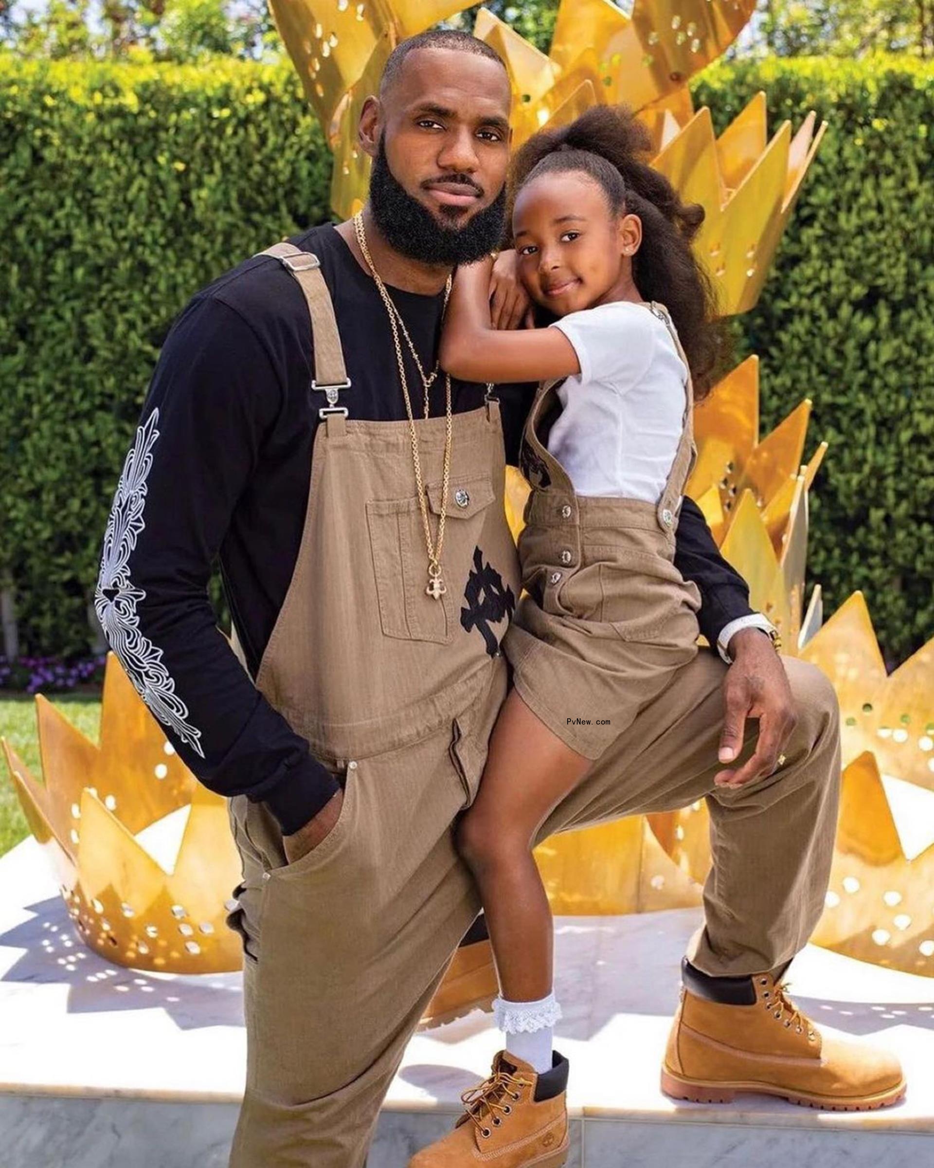 LeBron James holding his daughter, Zhuri.