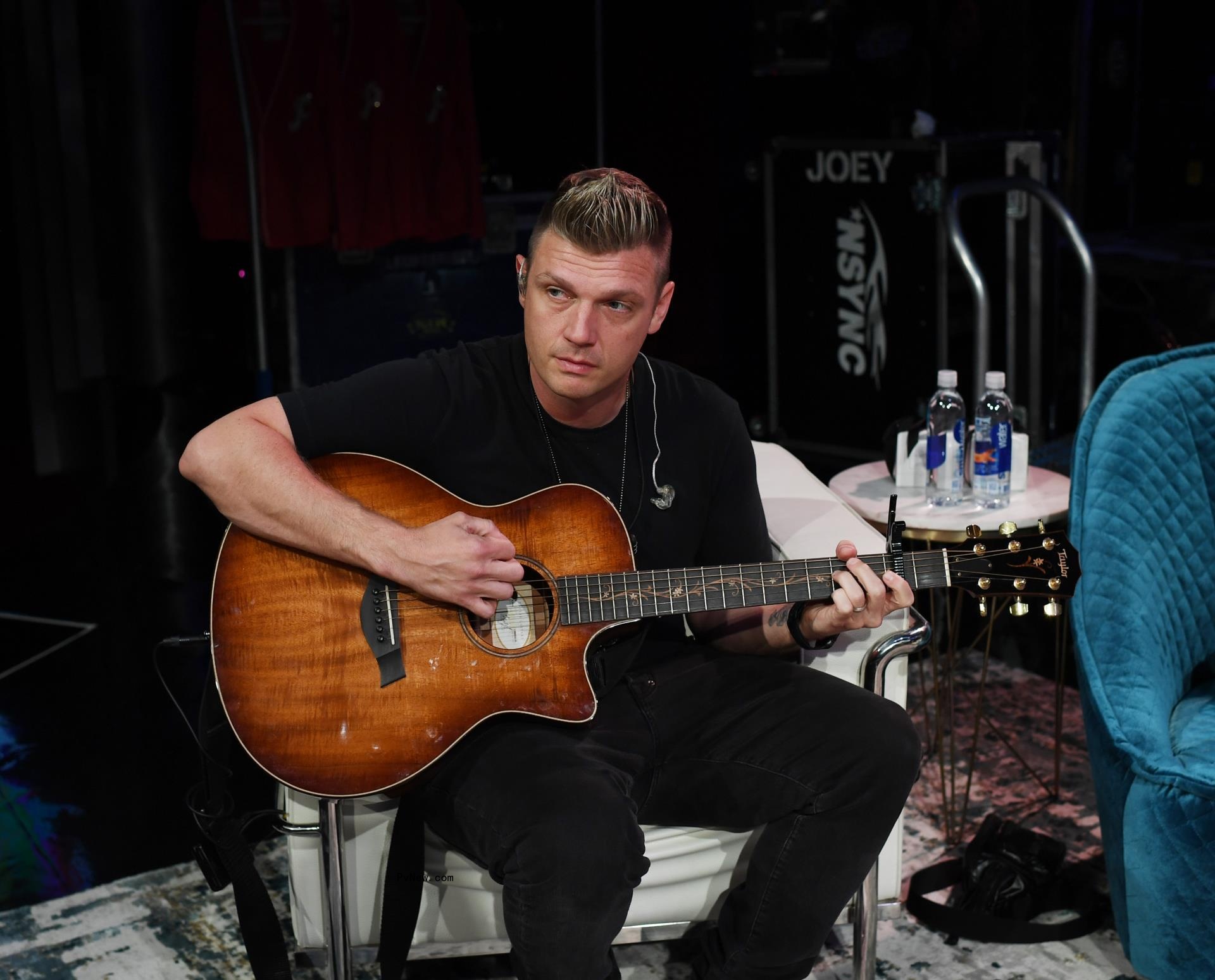 Nick Carter playing the guitar.