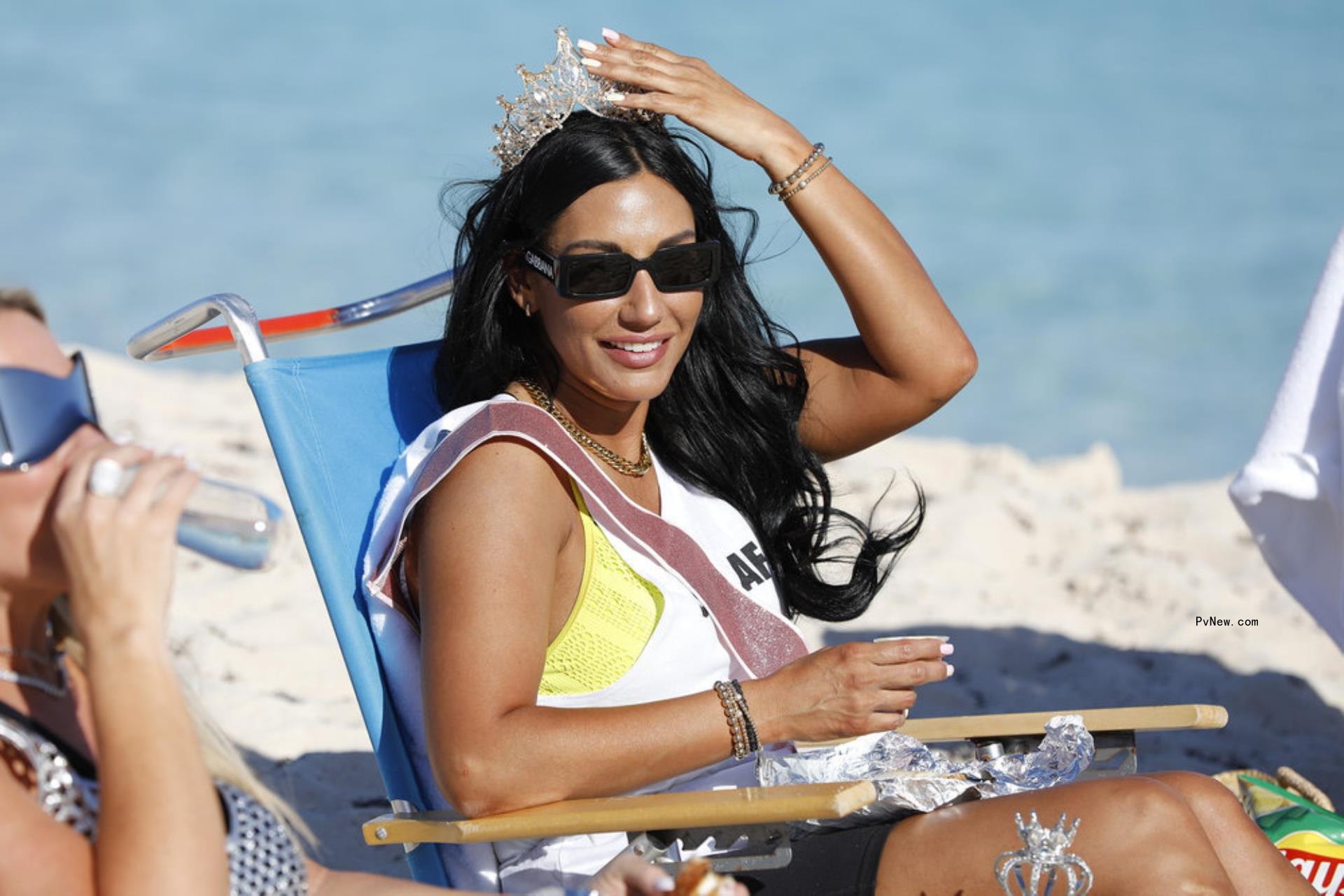Mo<i></i>nica Garcia sitting on the beach