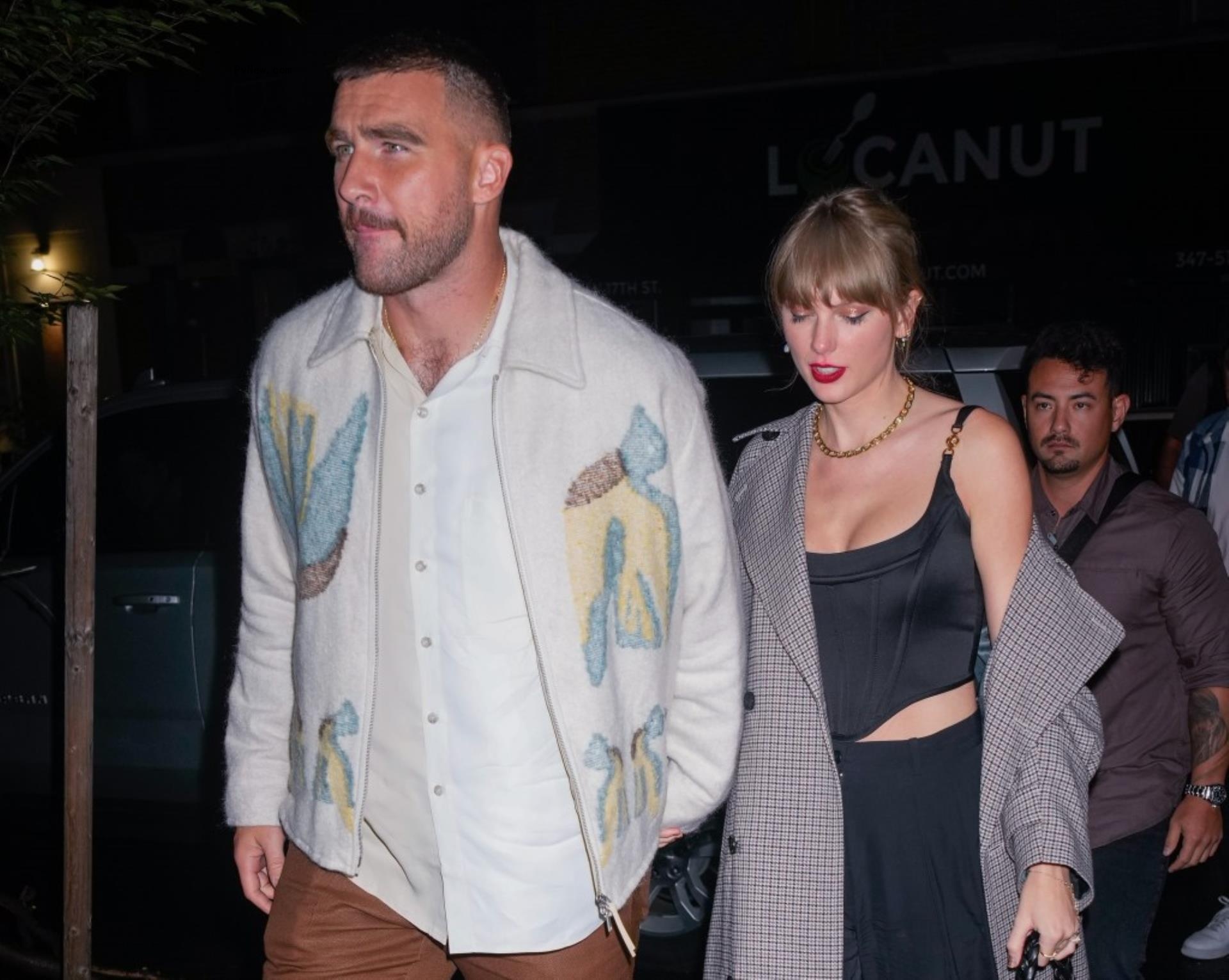 Taylor Swift and Travis Kelce walking
