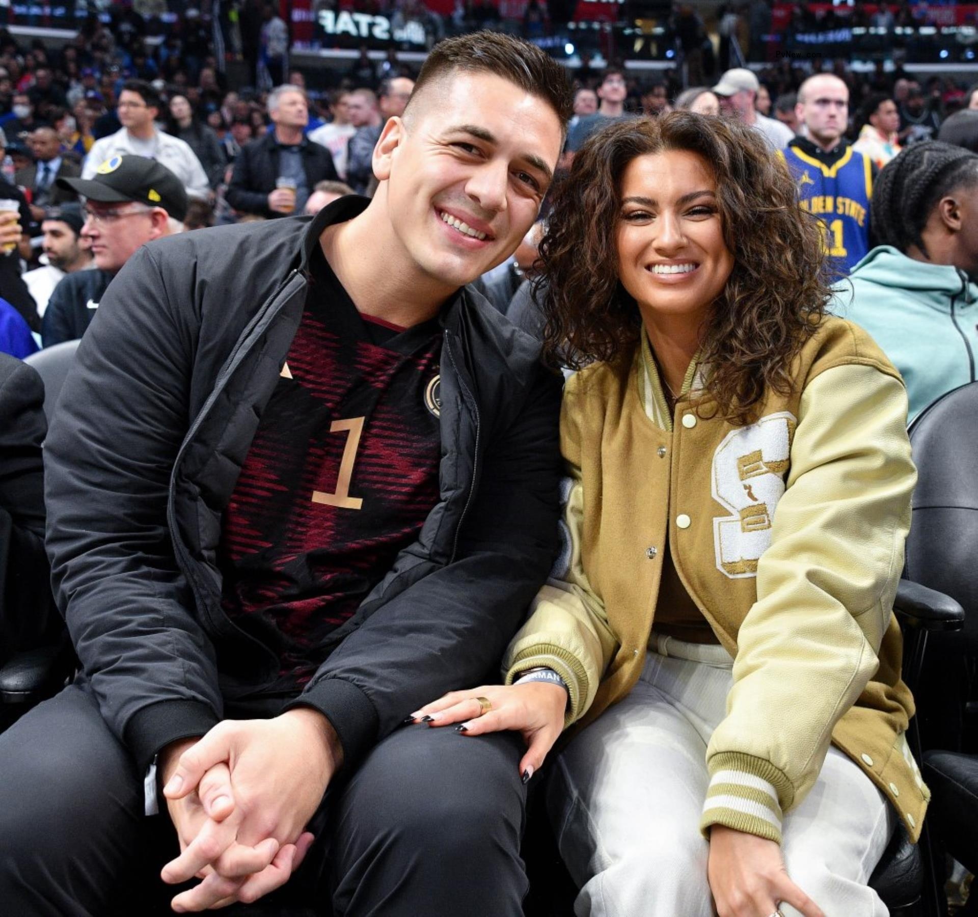 Tori Kelly and André Murillo at a basketball game together.
