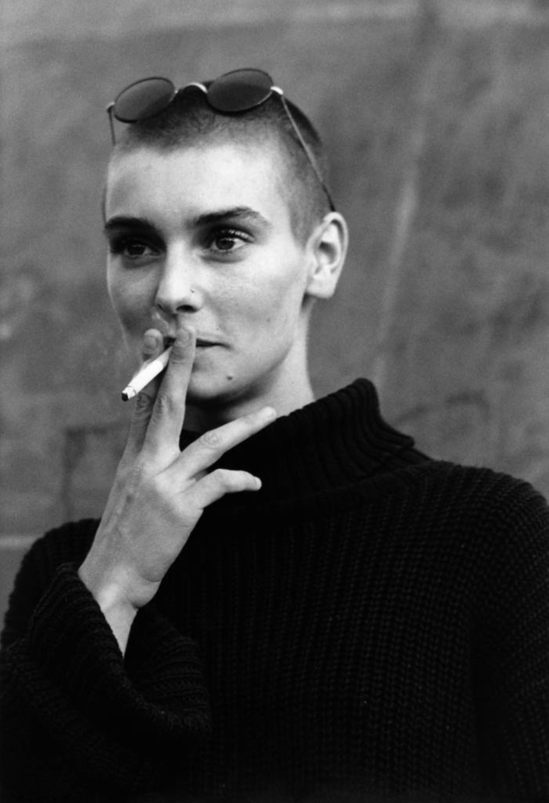 Sinéad O'Co<i></i>nnor smoking a cigarette.