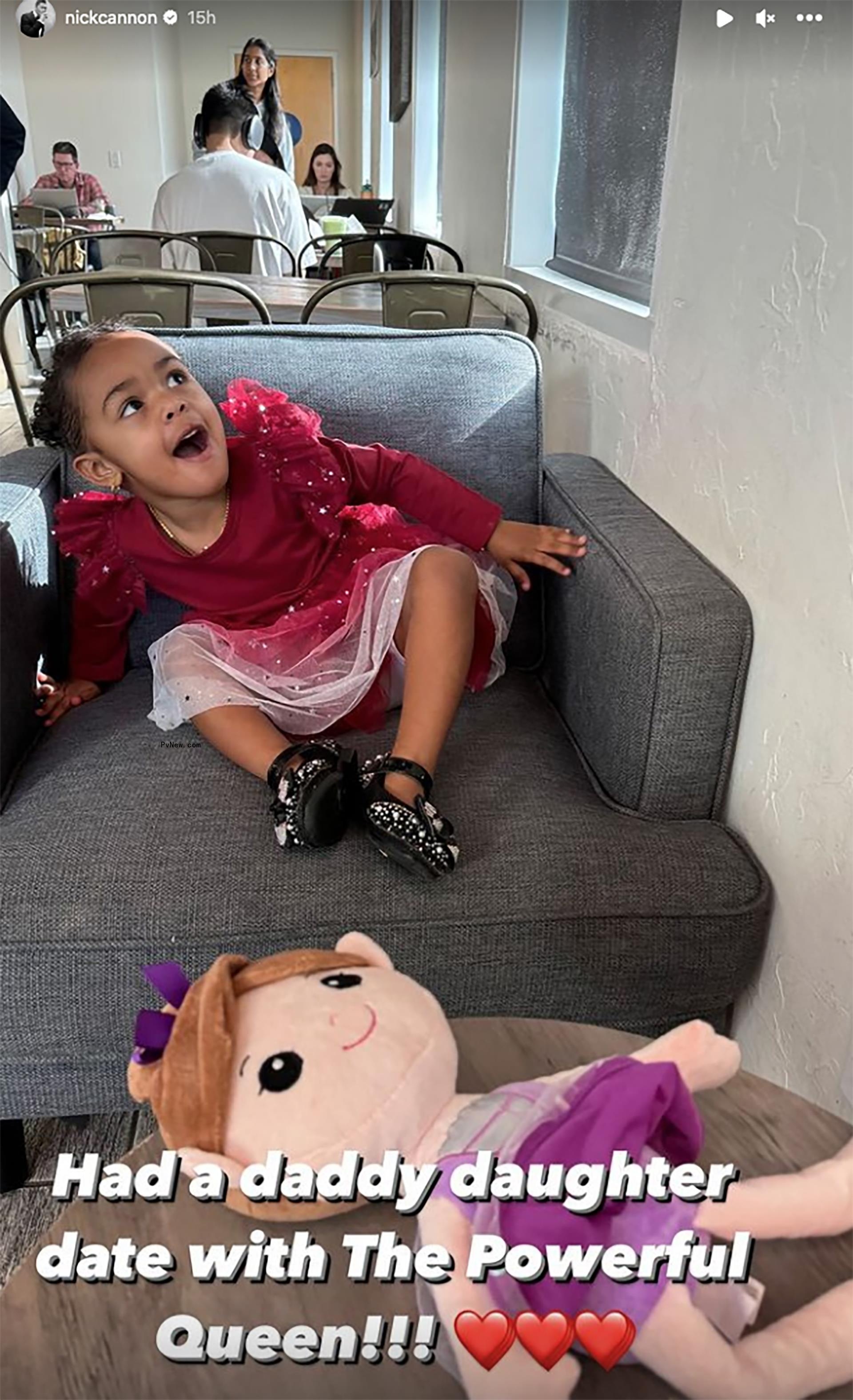 Nick Cannon's daughter Powerful Queen sitting in a chair