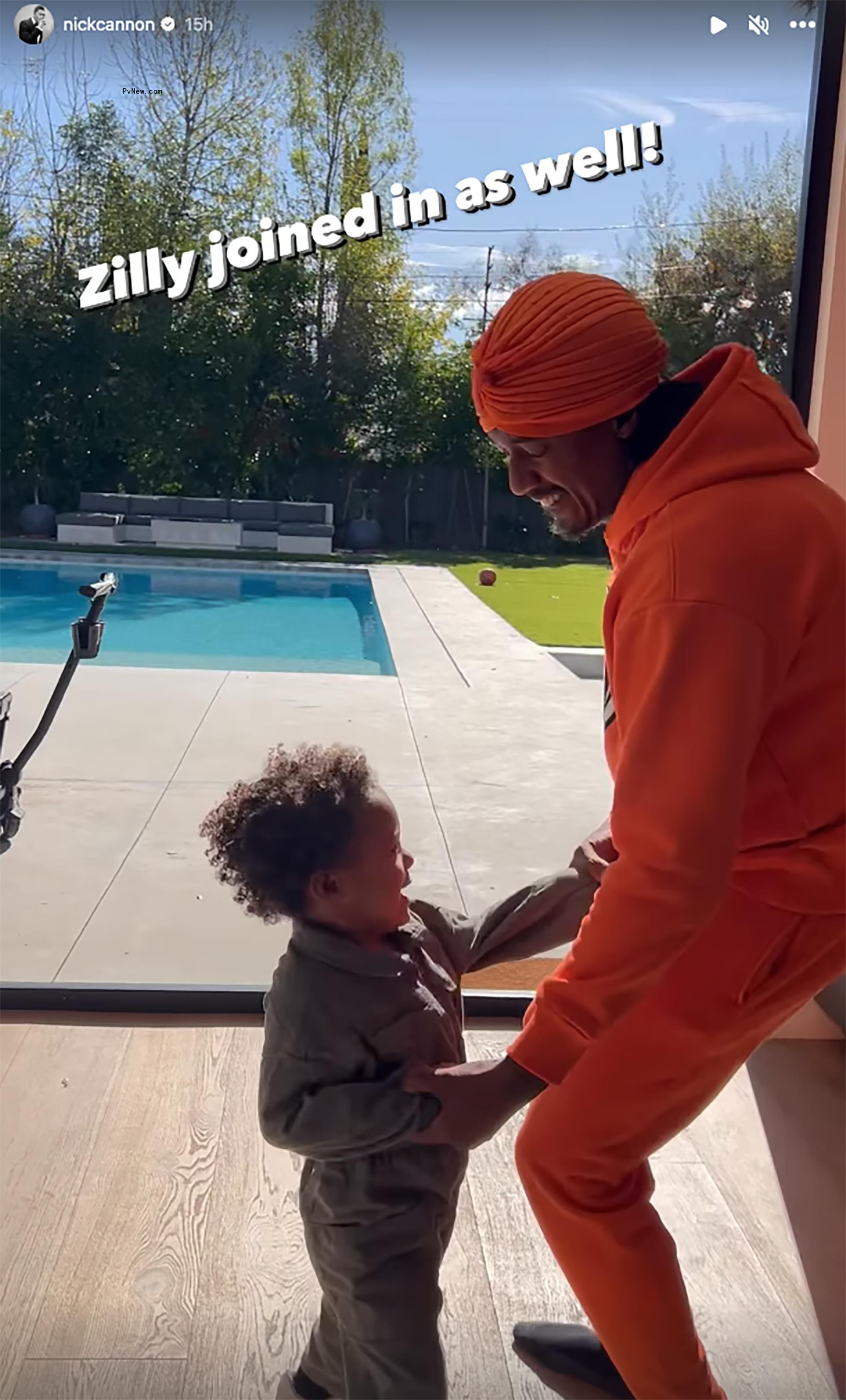 Nick Cannon dancing with his son