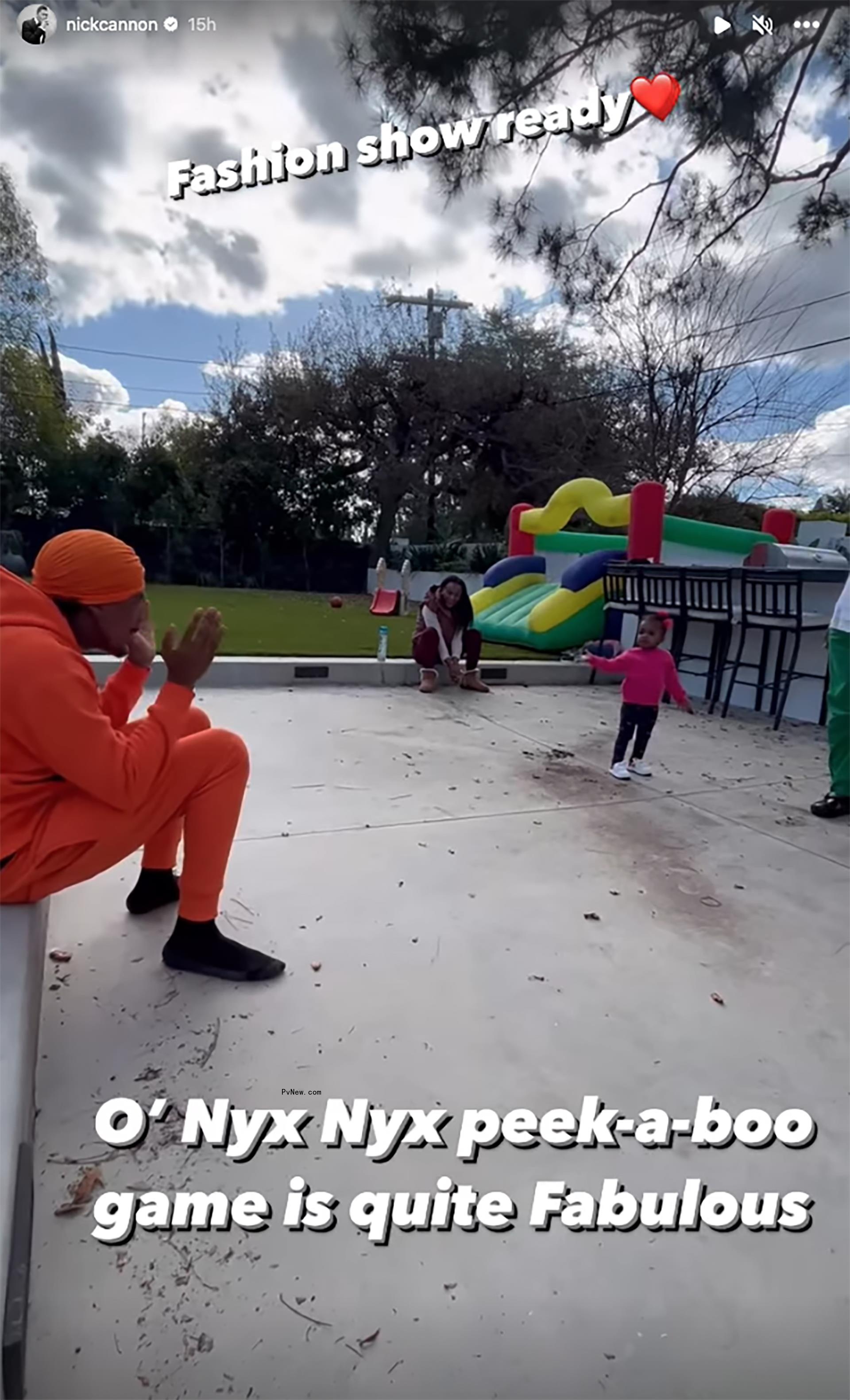 Nick Cannon playing peekaboo with his kids