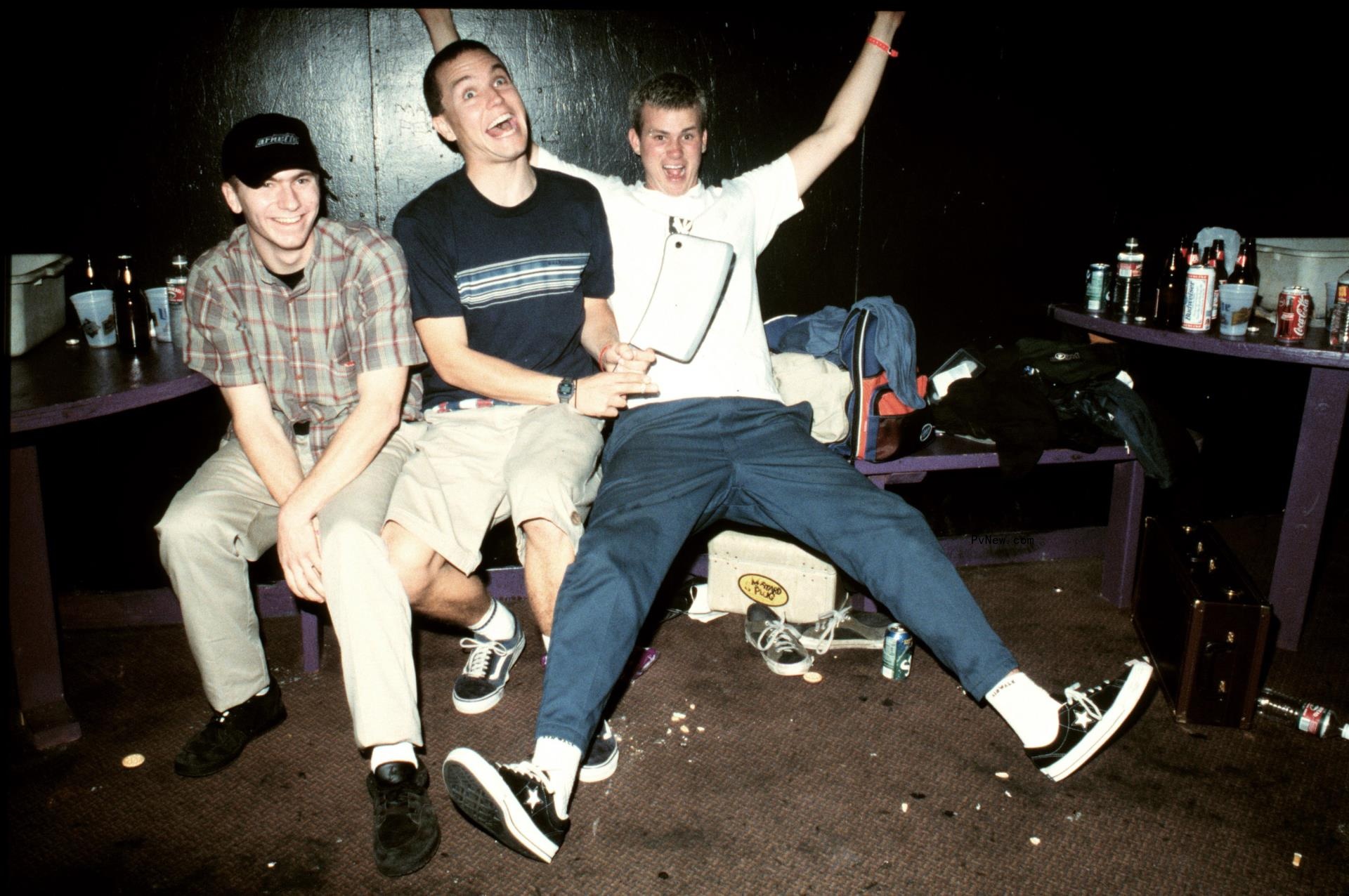 Travis Barker, Mark Hoppus, Tom DeLo<i></i>nge posing for a photo together 