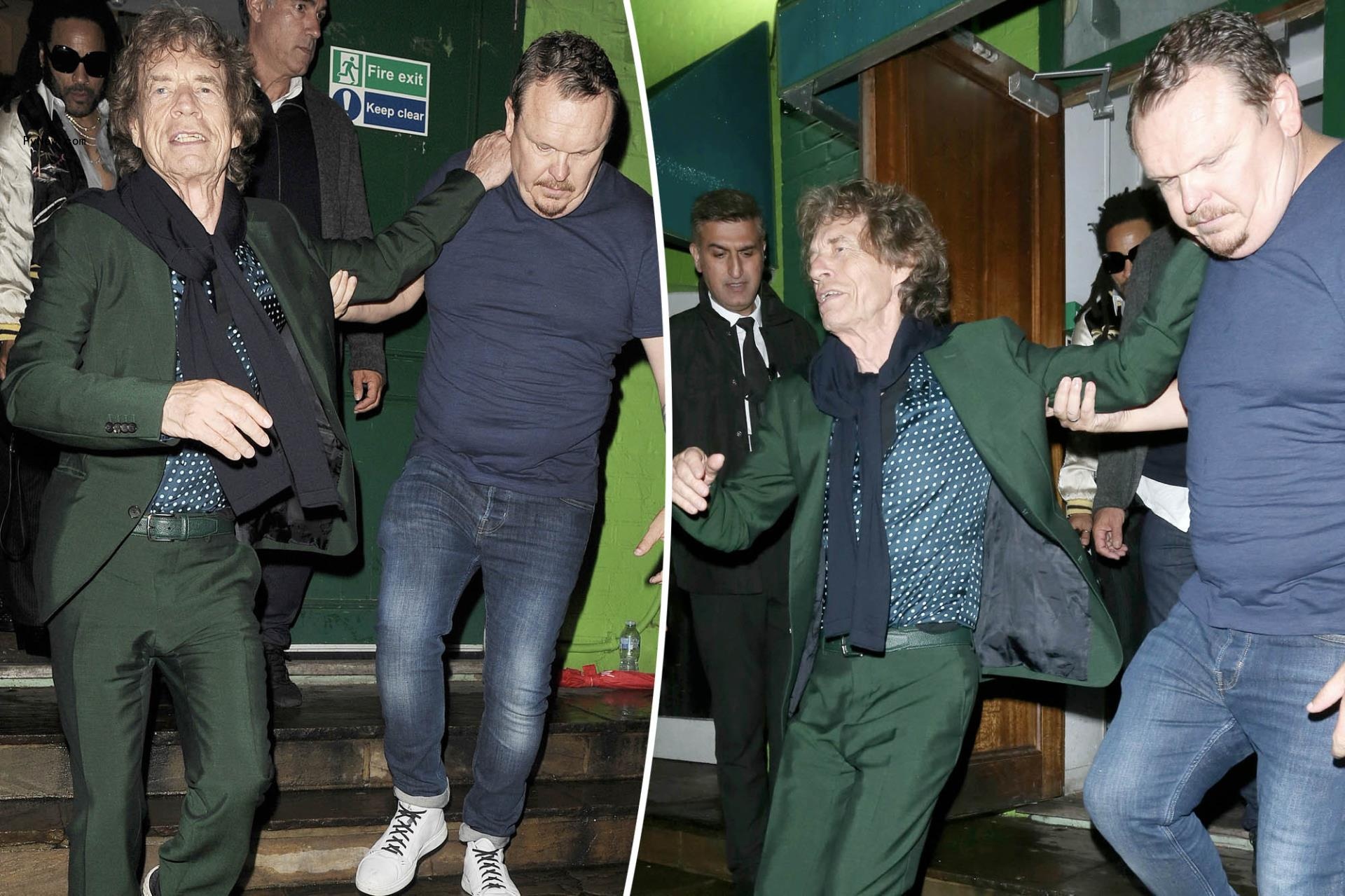 Mick Jagger needs assistance leaving star-studded 80th birthday bash in London