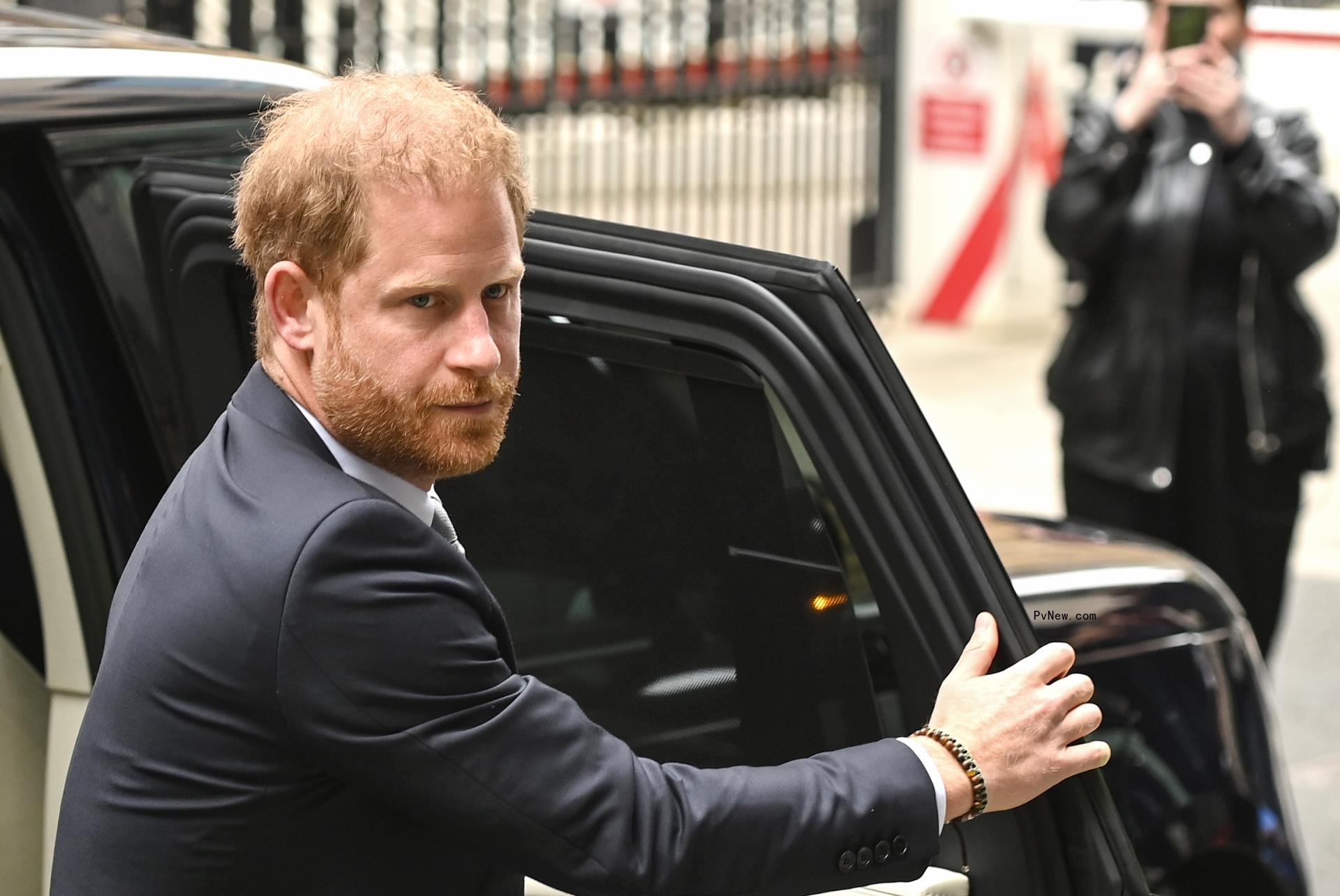 prince harry exiting a car