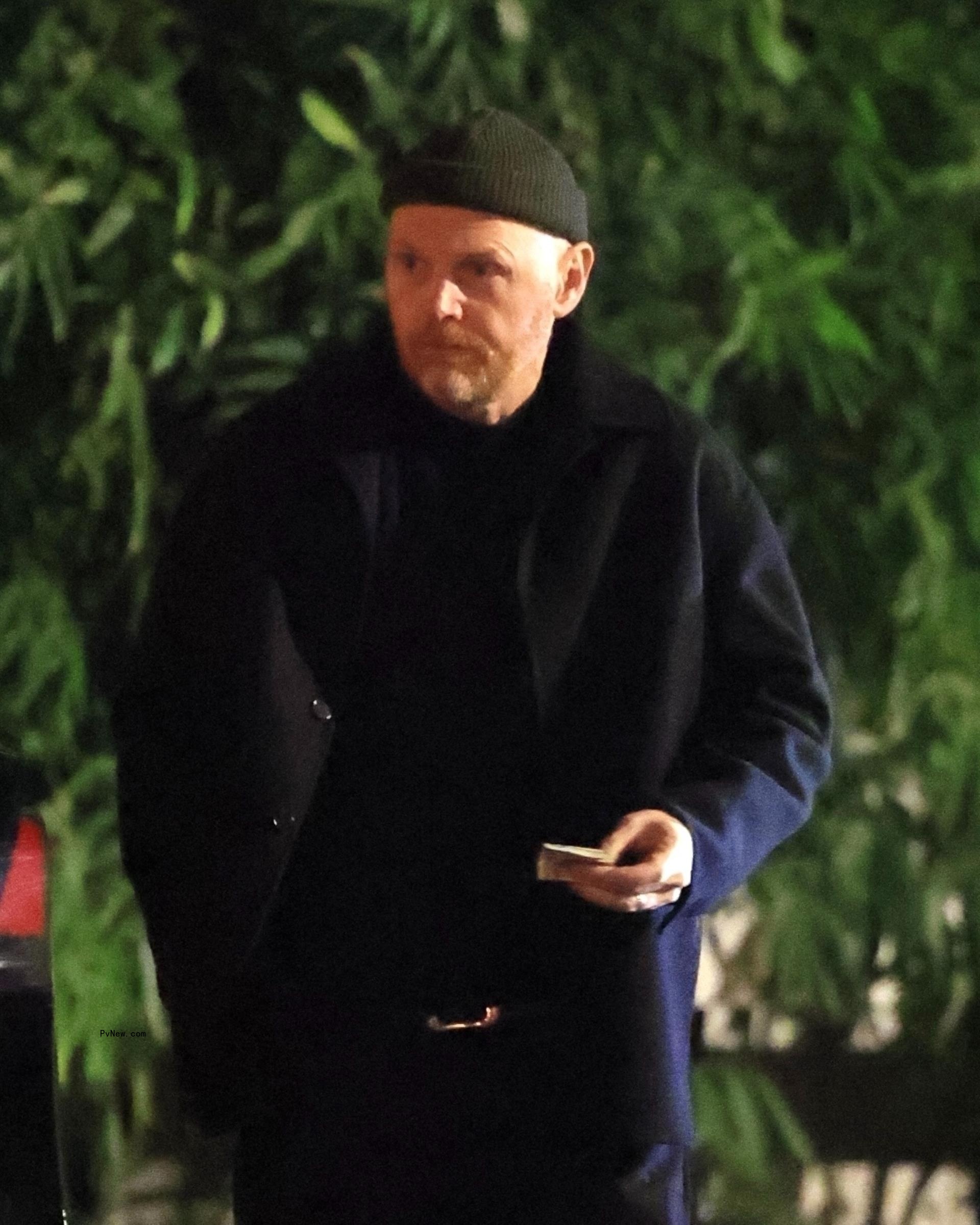 Bill Burr leaving a restaurant.
