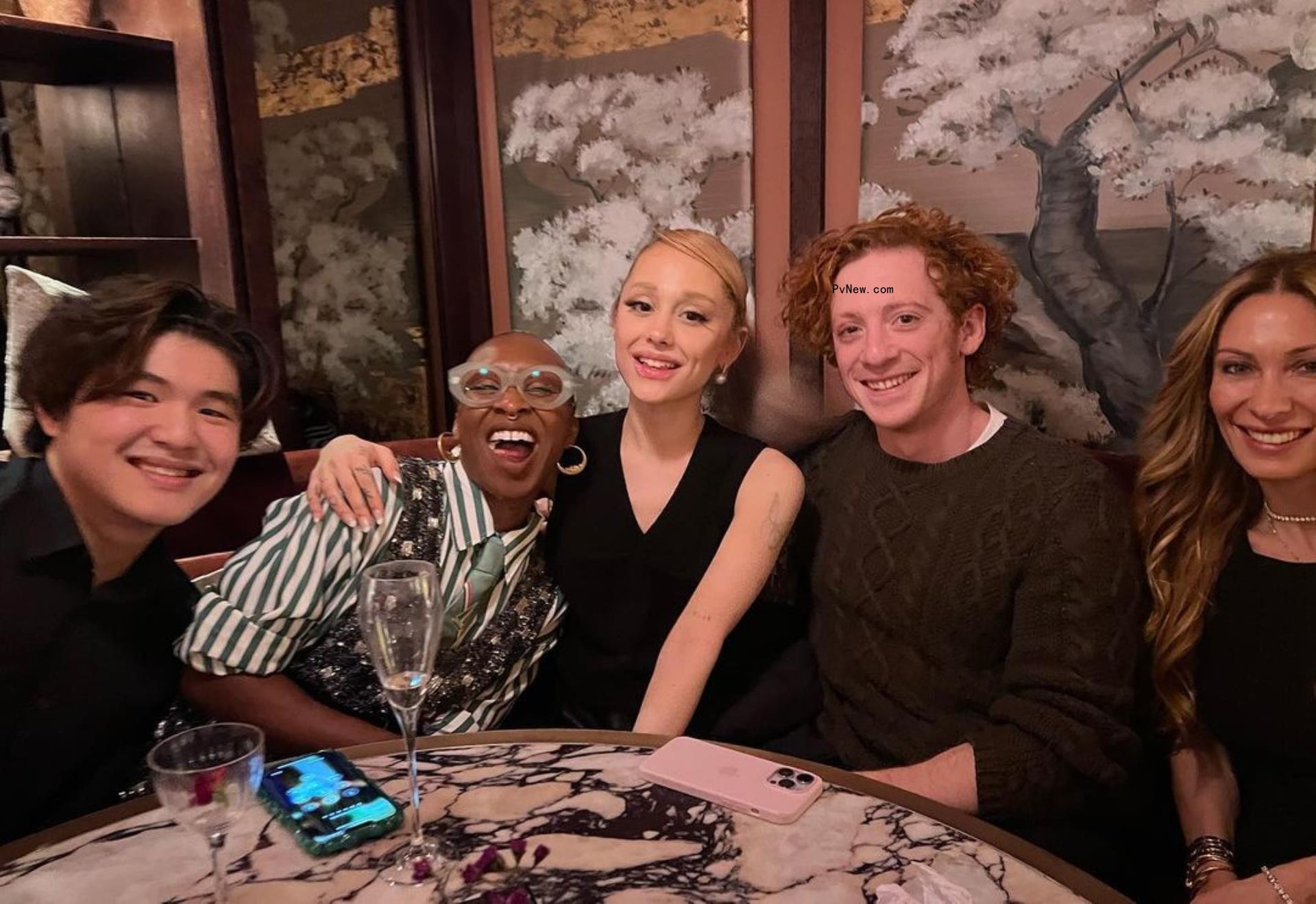 Ethan Slater and Ariana Grande at a dinner.
