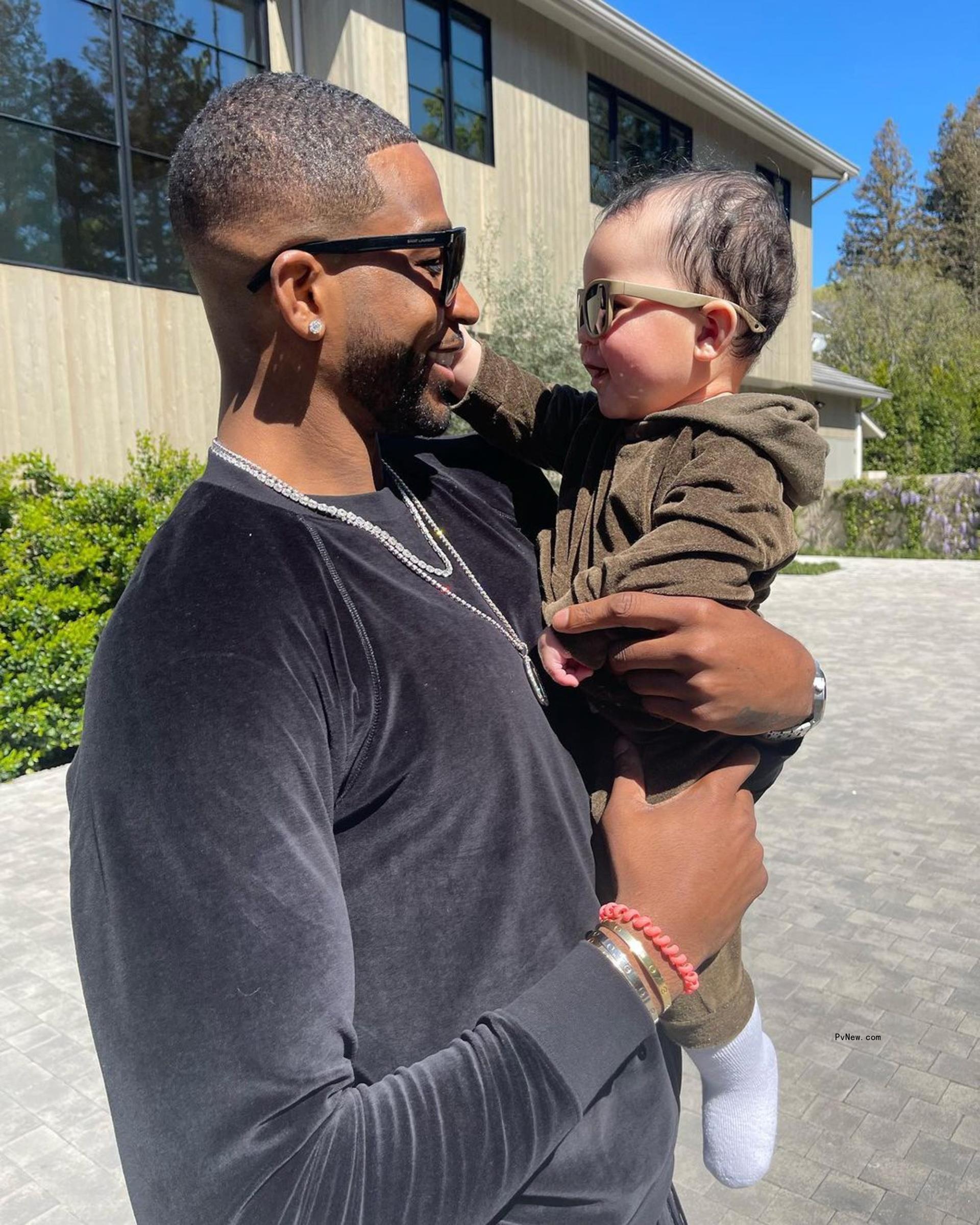 Tristan Thompson holding his son Tatum.