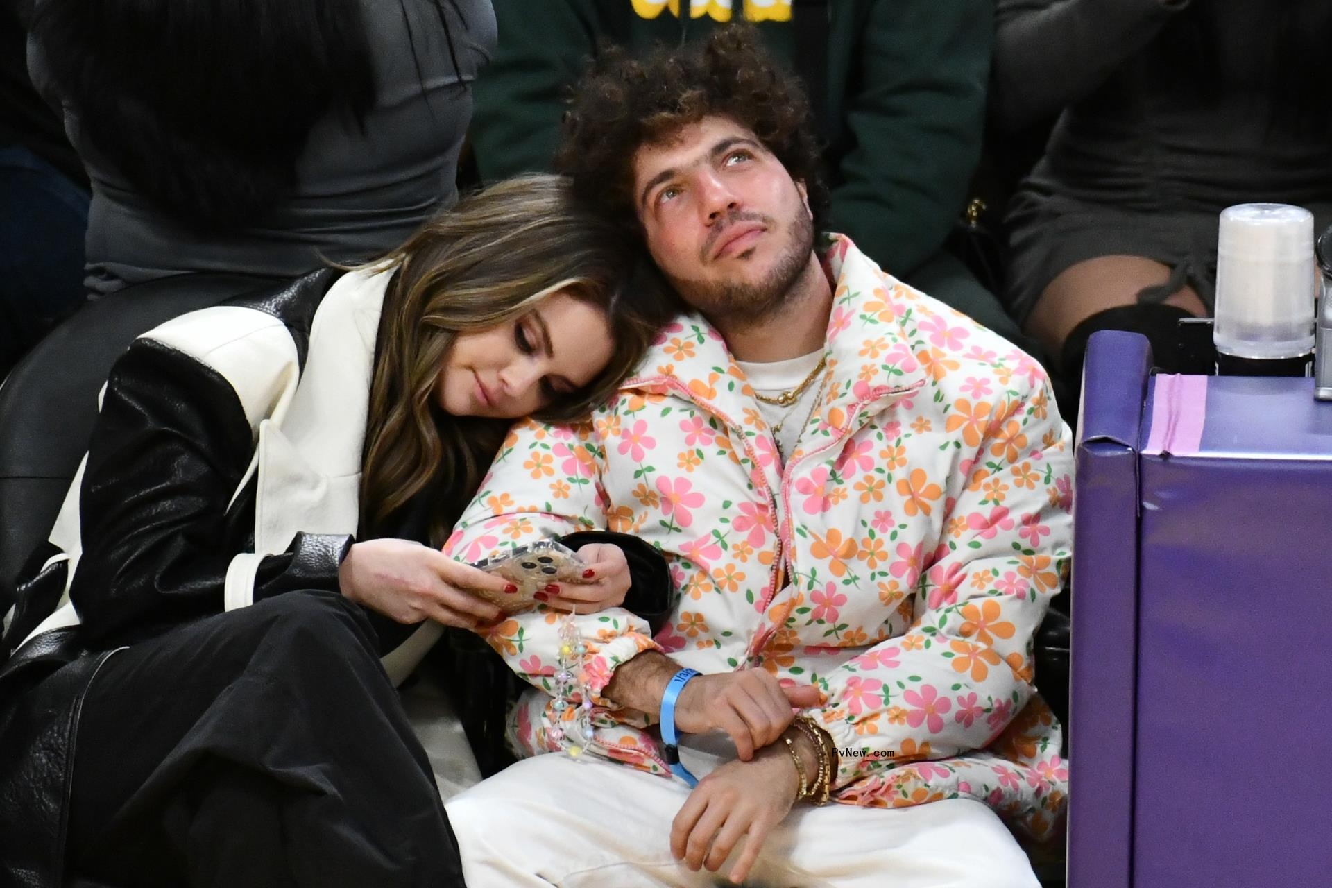 Selena Gomez and Benny Blanco sitting together