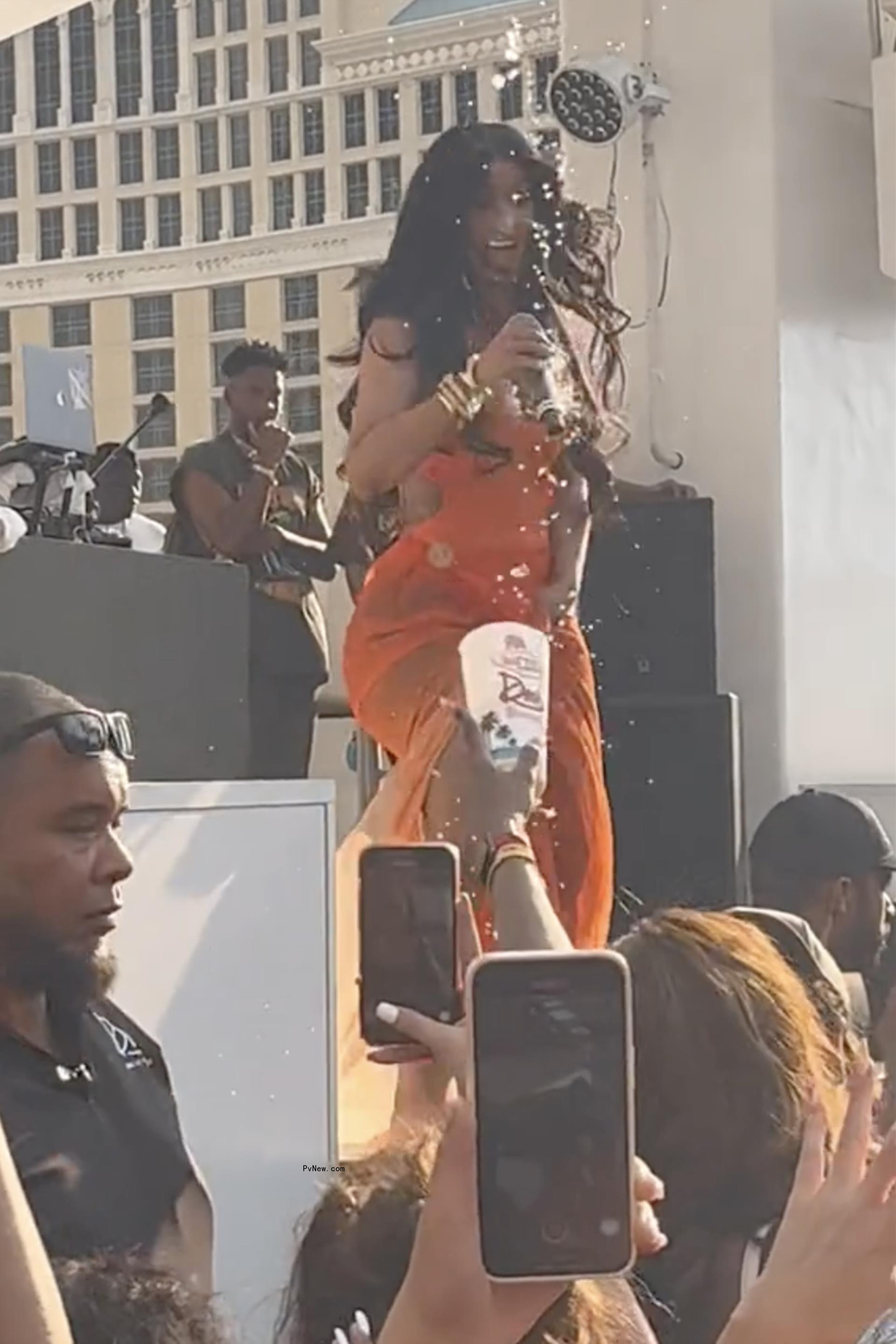 Cardi B being hit with drink