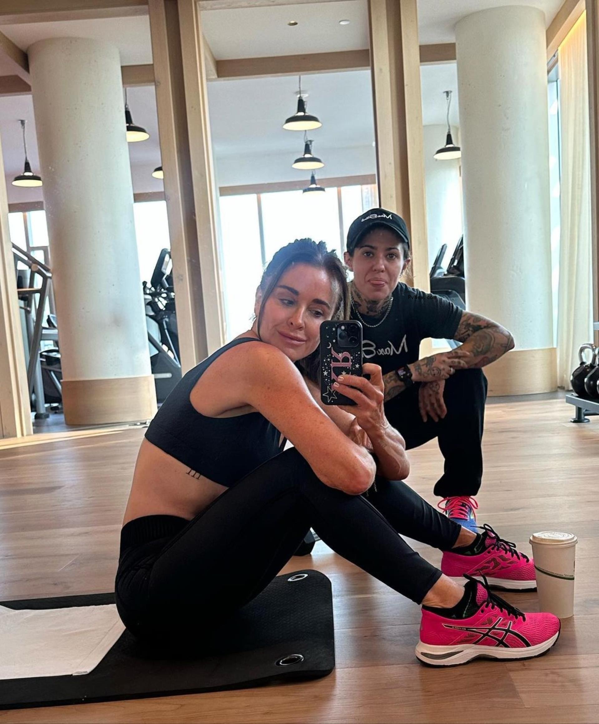 A mirror selfie of Kyle Richards and Morgan Wade working out.