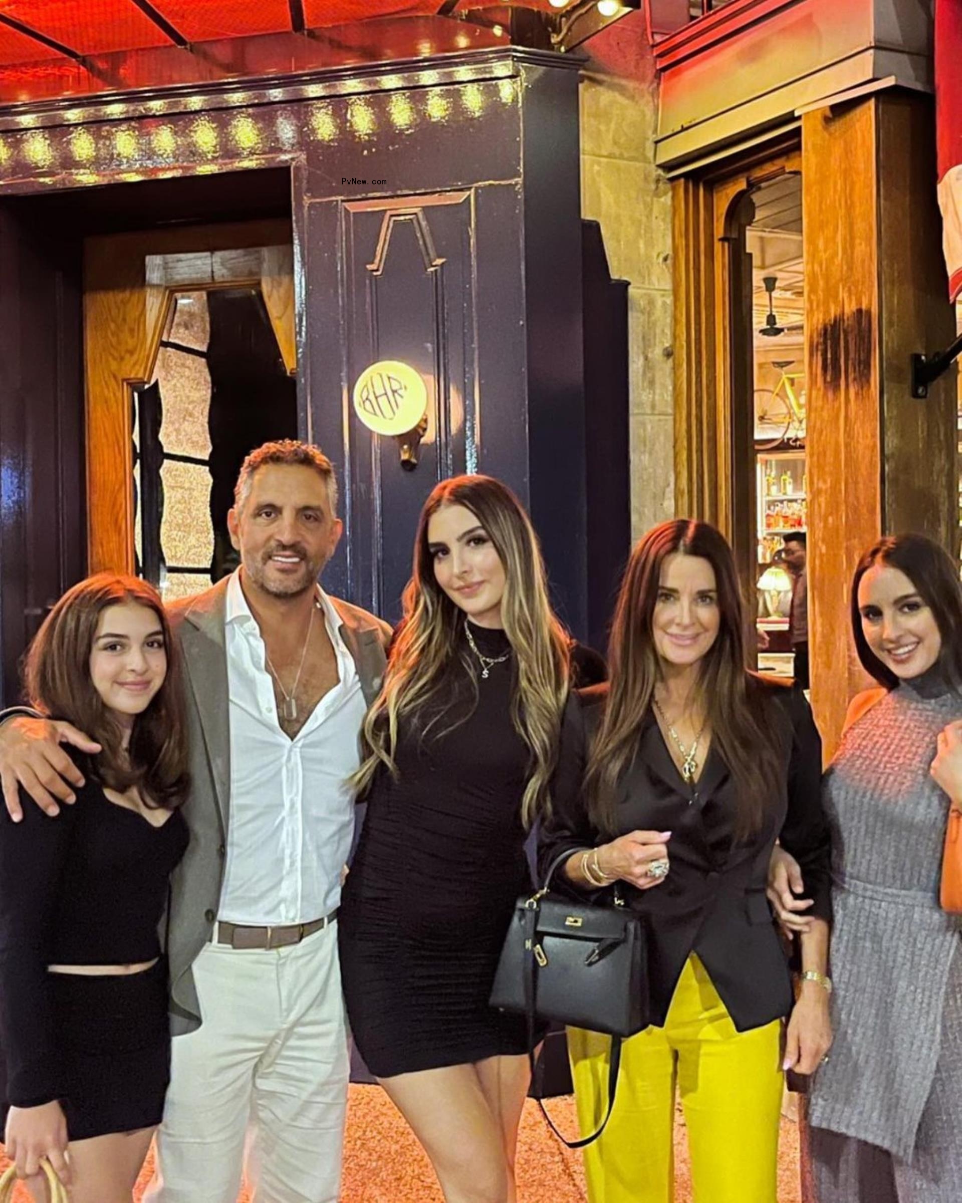 Kyle Richards and Mauricio Umansky and their daughters.