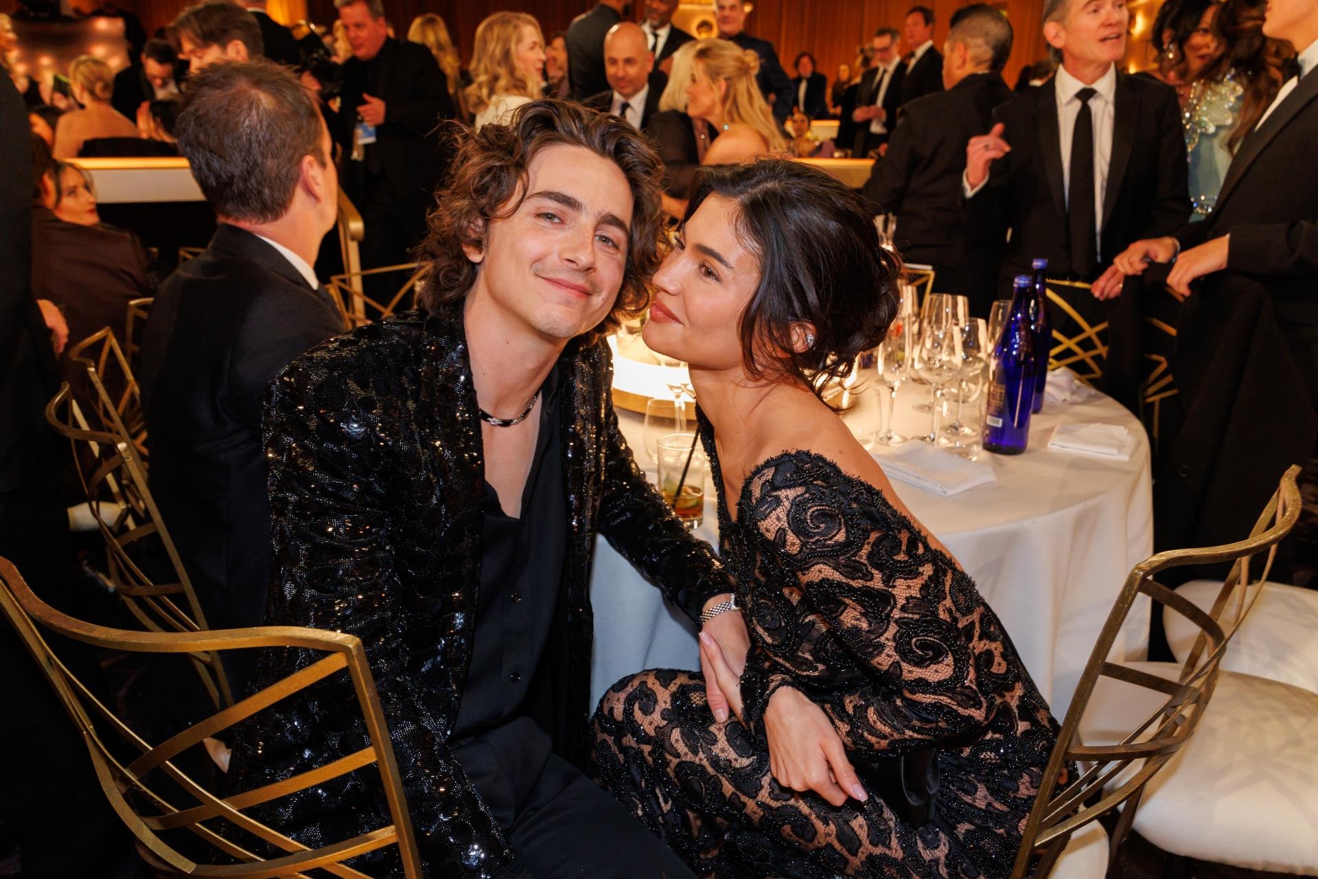Timothée Chalamet and Kylie Jenner sitting together at the 2024 Golden Globes.