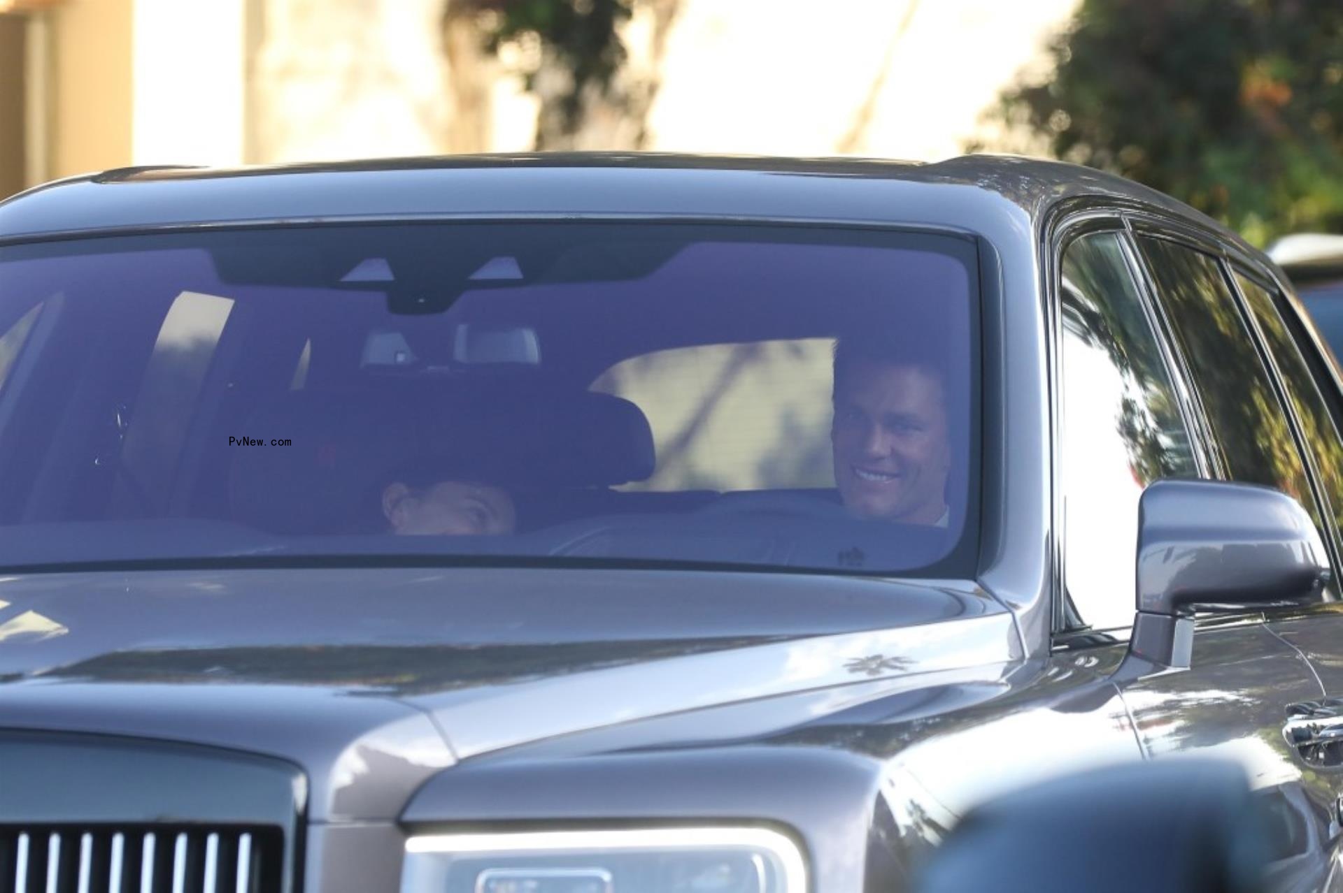 Tom Brady and Irina Shayk in his car.