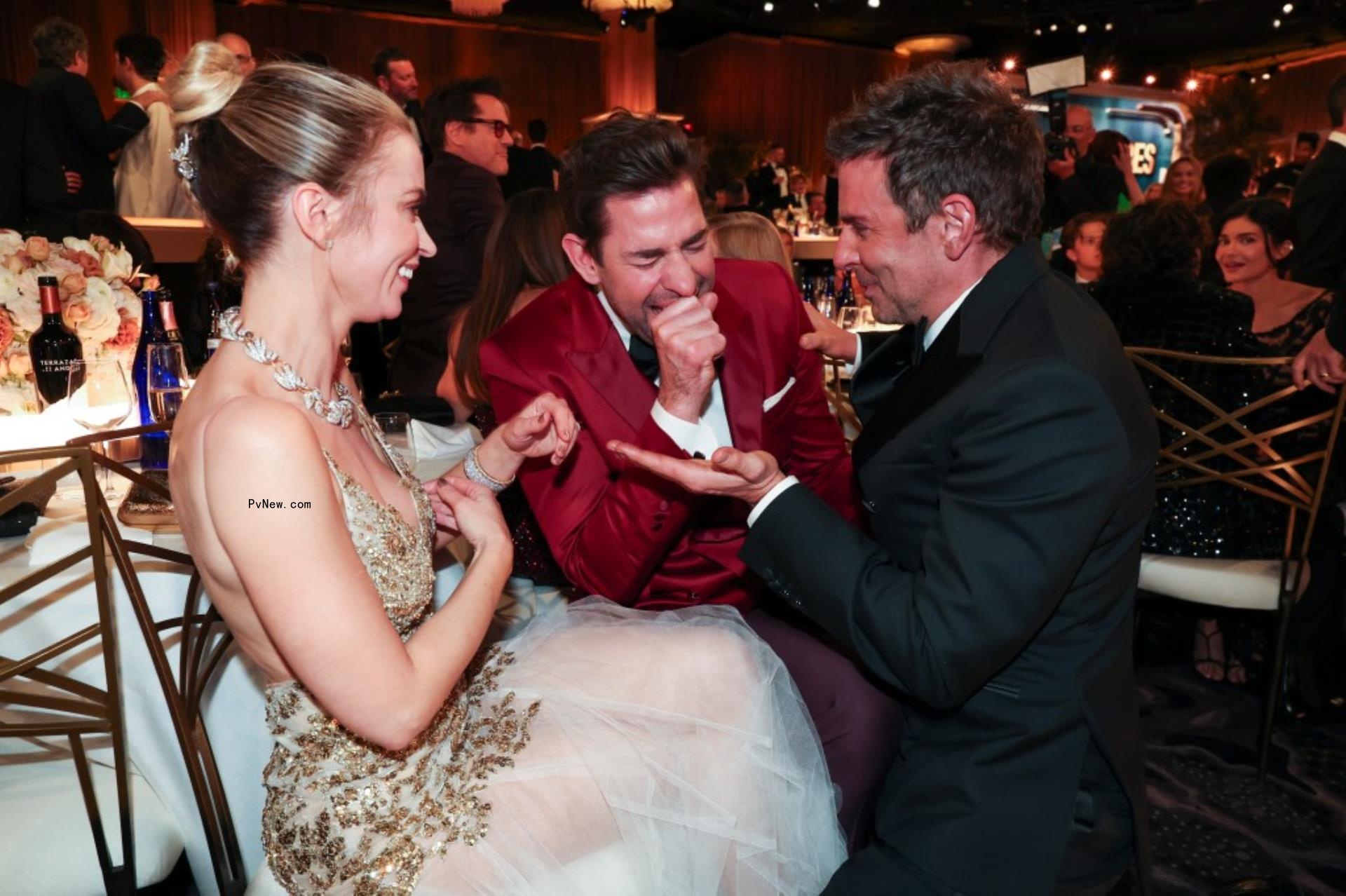 emily blunt, john krasinski and bradley cooper laughing inside golden globes 2024