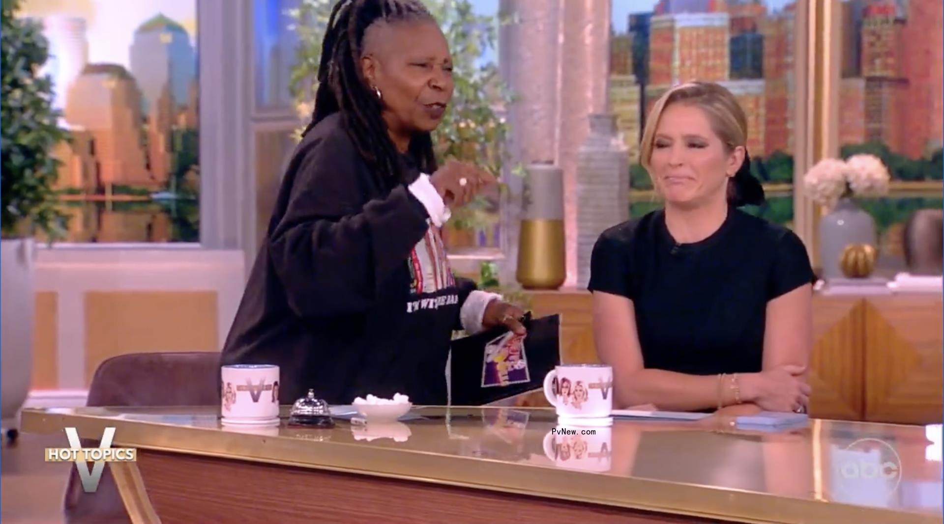 Whoopi Goldberg walking away from the table on 