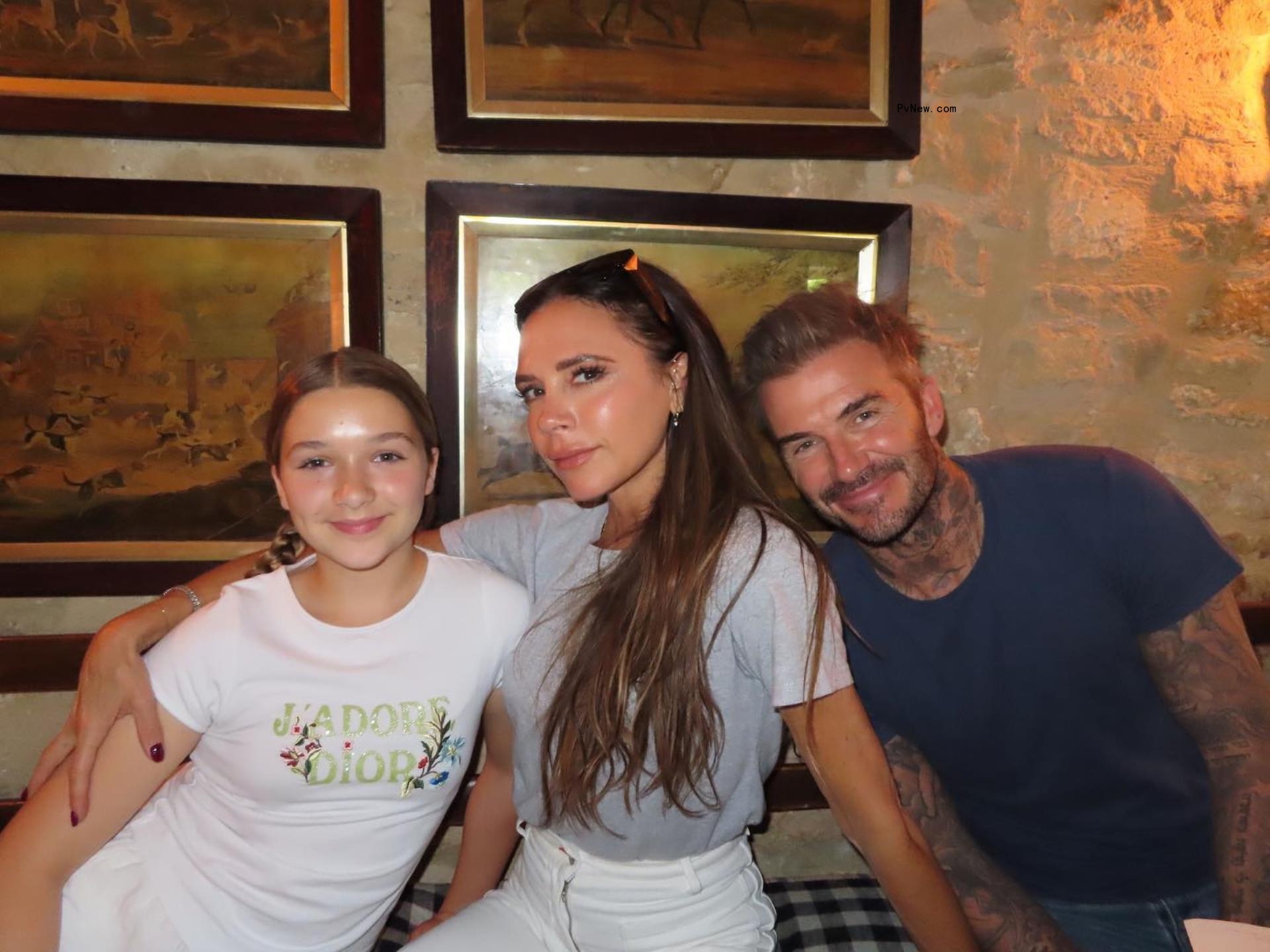 Harper Beckham, Victoria Beckham and David Beckham posing together