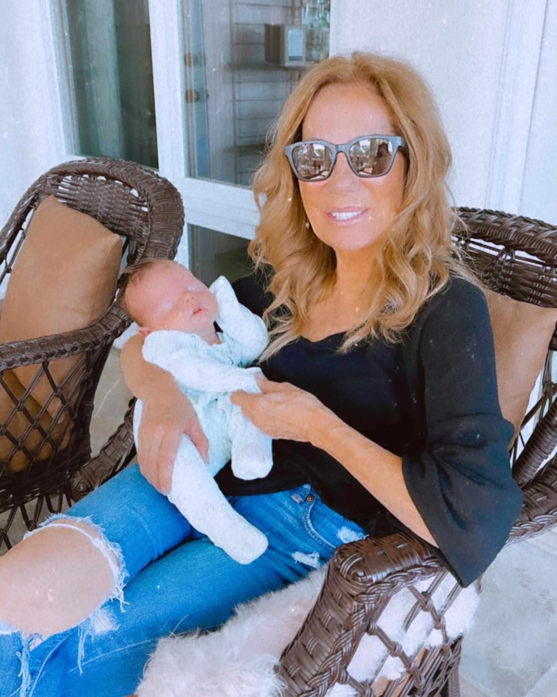 Kathie Lee Gifford holding her grandchild 