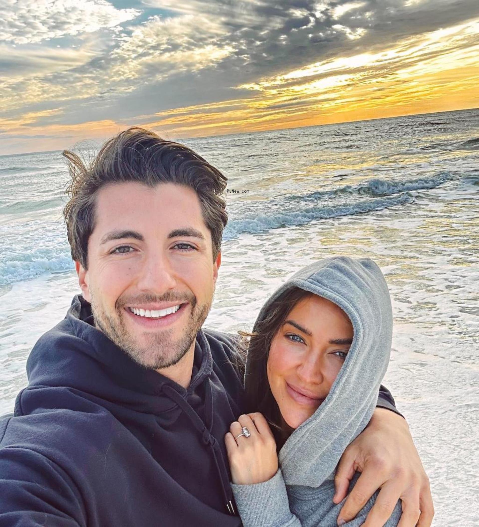 A selfie of Jason Tartick and Kaitlyn Bristowe on a beach.