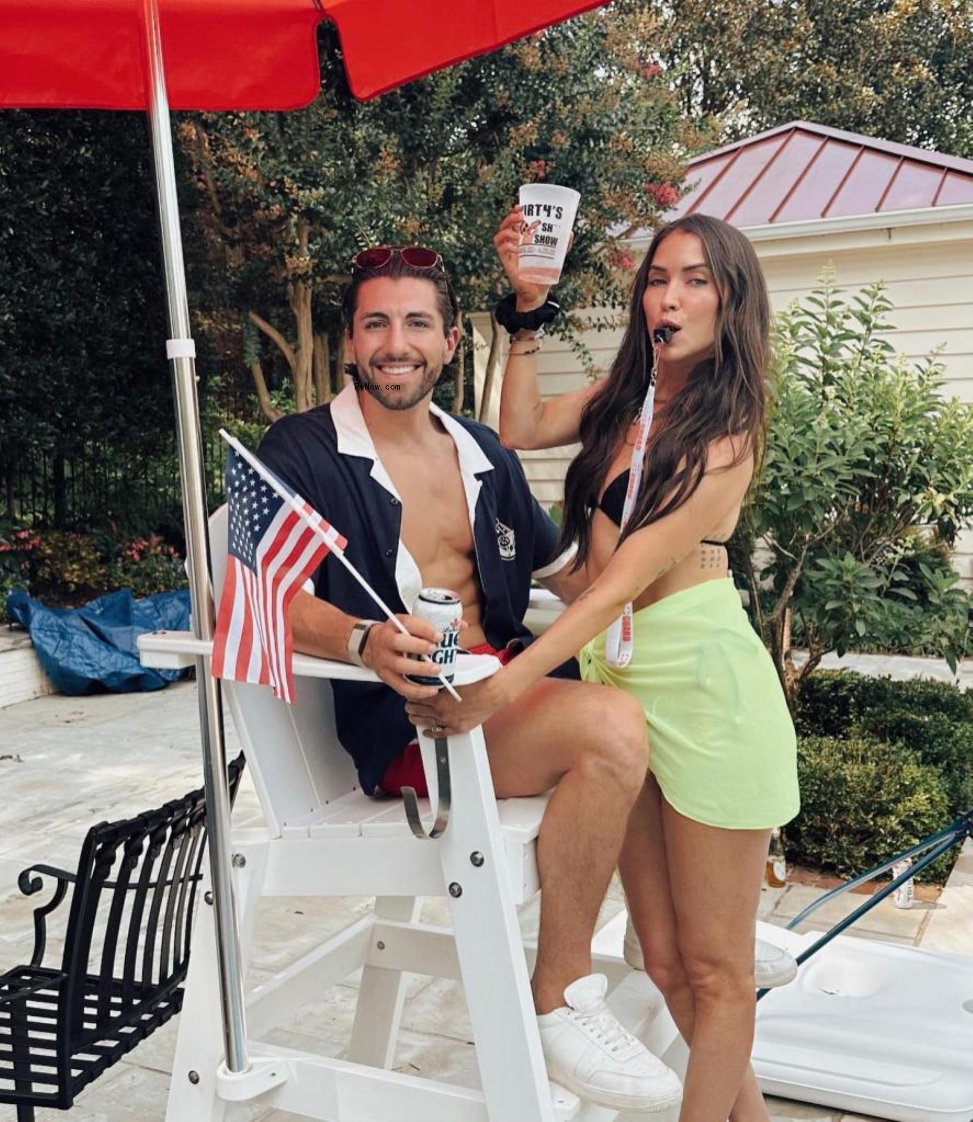 Jason Tartick and Kaitlyn Bristowe posing together in swimwear on the Fourth of July.