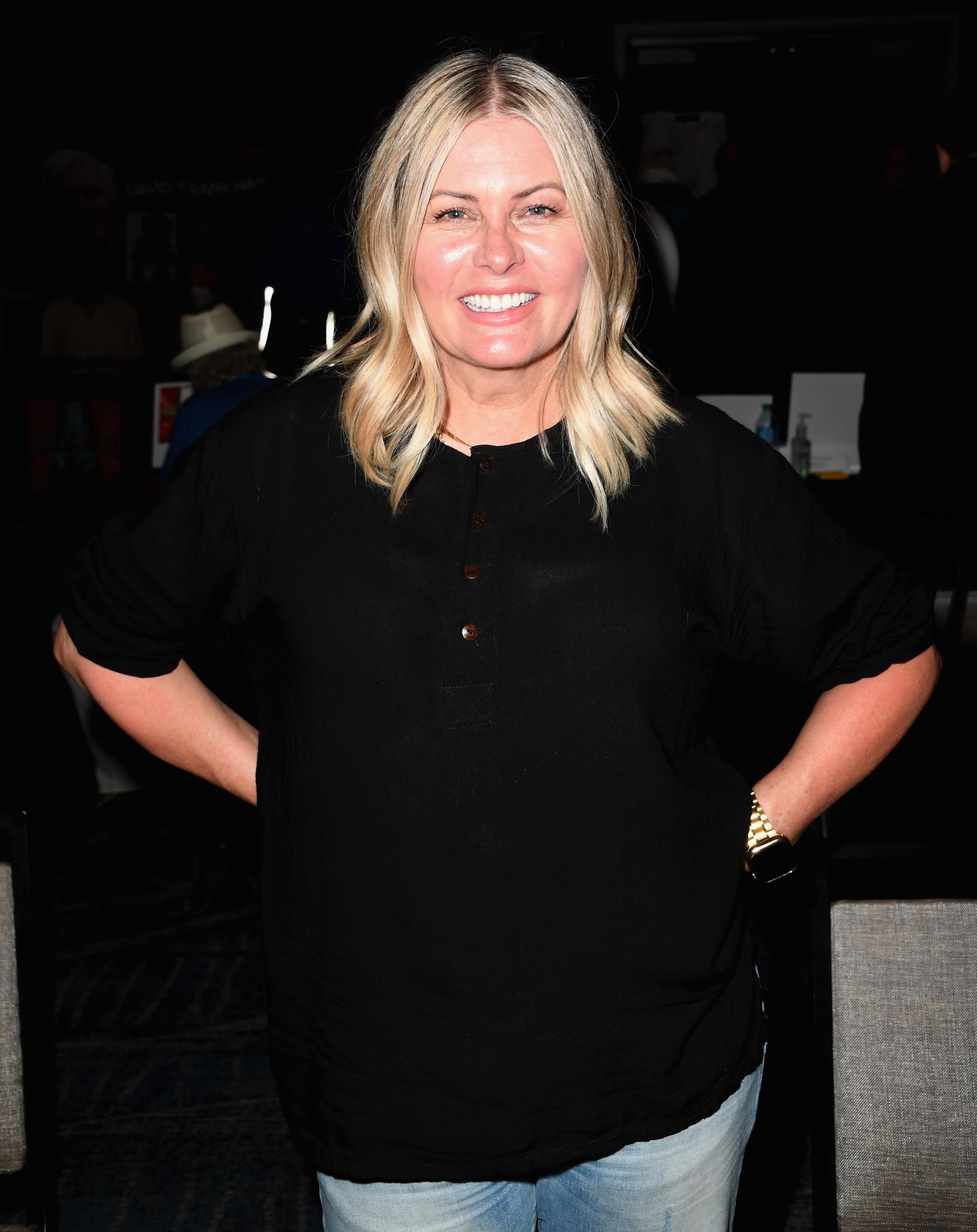 Nicole Eggert posing for a photo