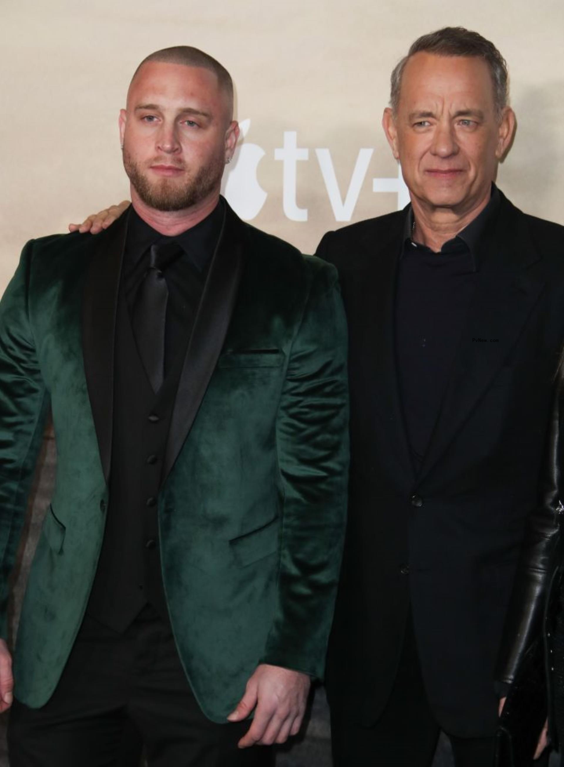 tom hanks with his hand on son Chet's shoulder
