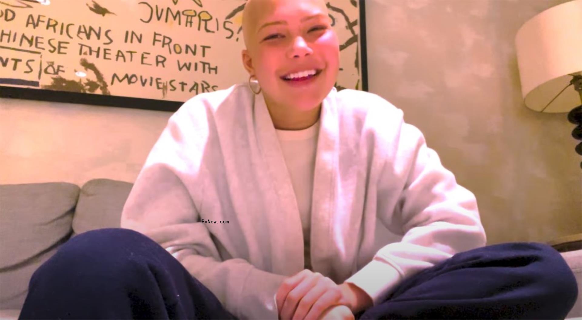 bald isabella strahan sitting on the couch