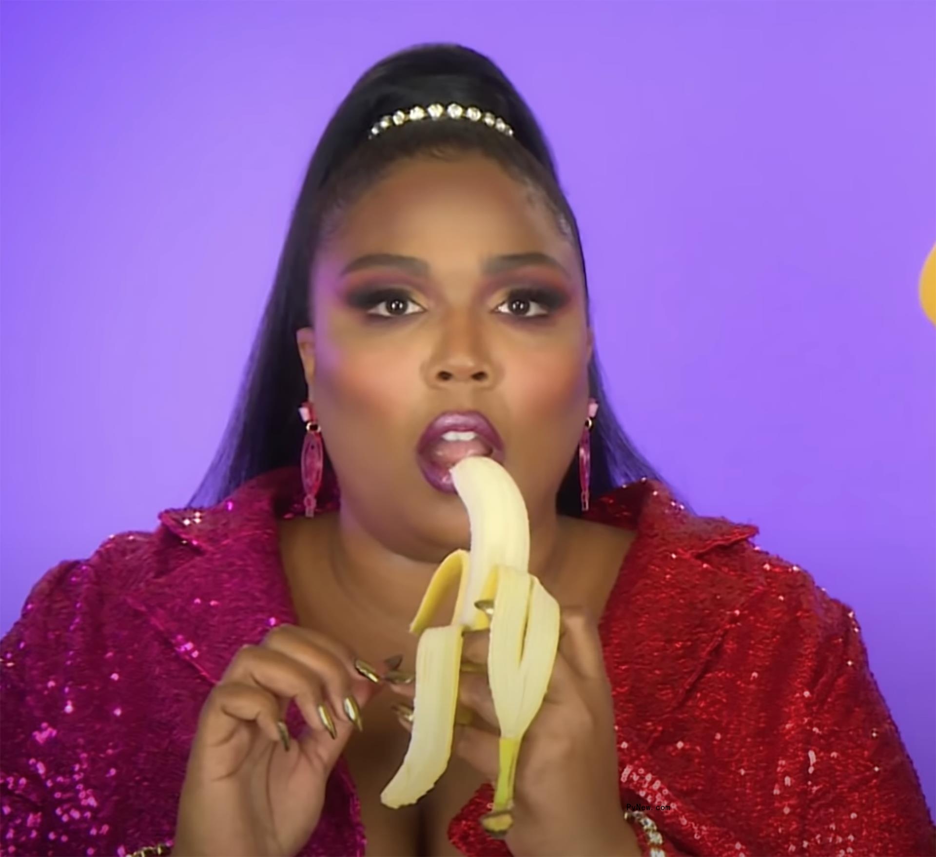 Lizzo eating a banana.