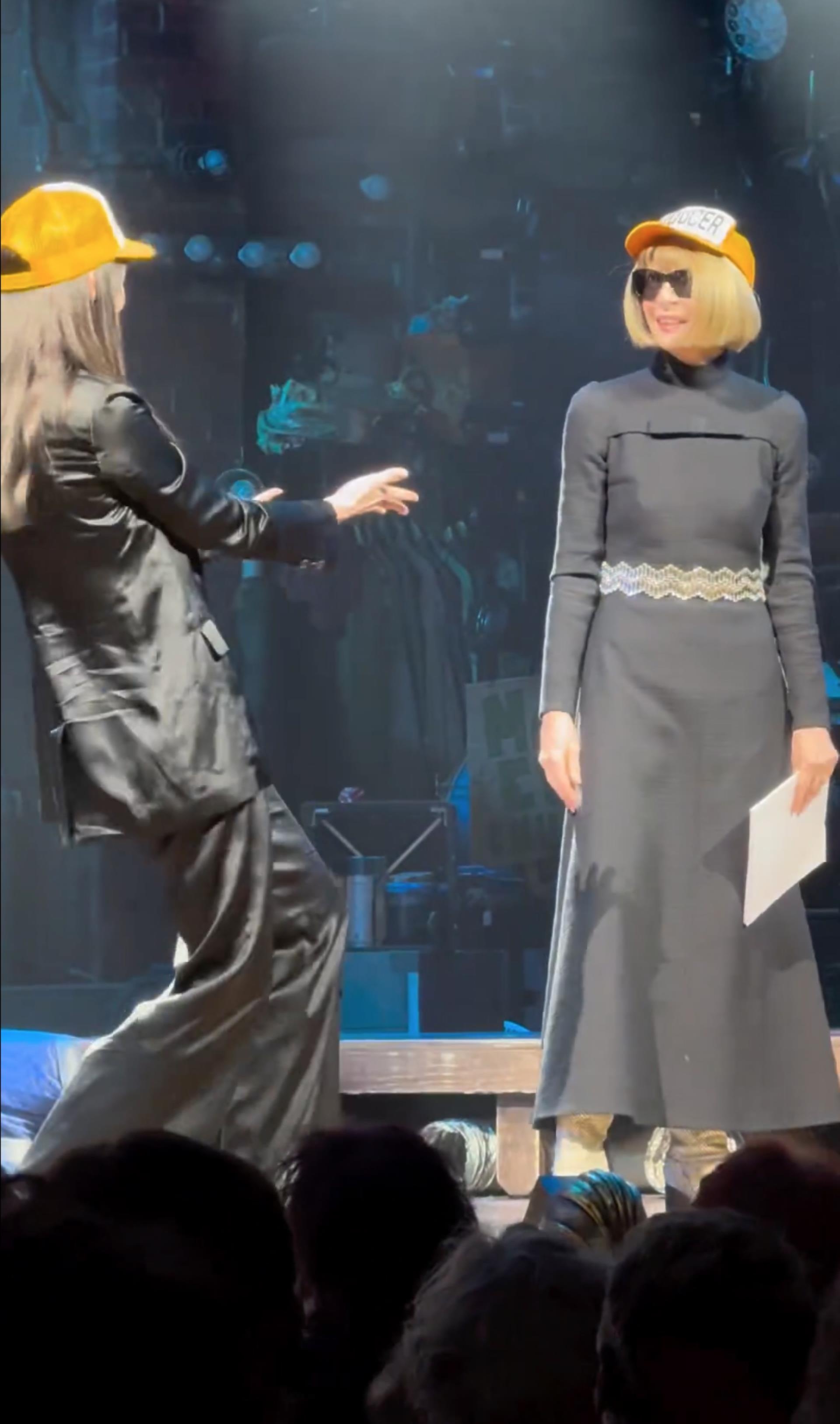 Anna Wintour and Anne Hathaway on stage at 