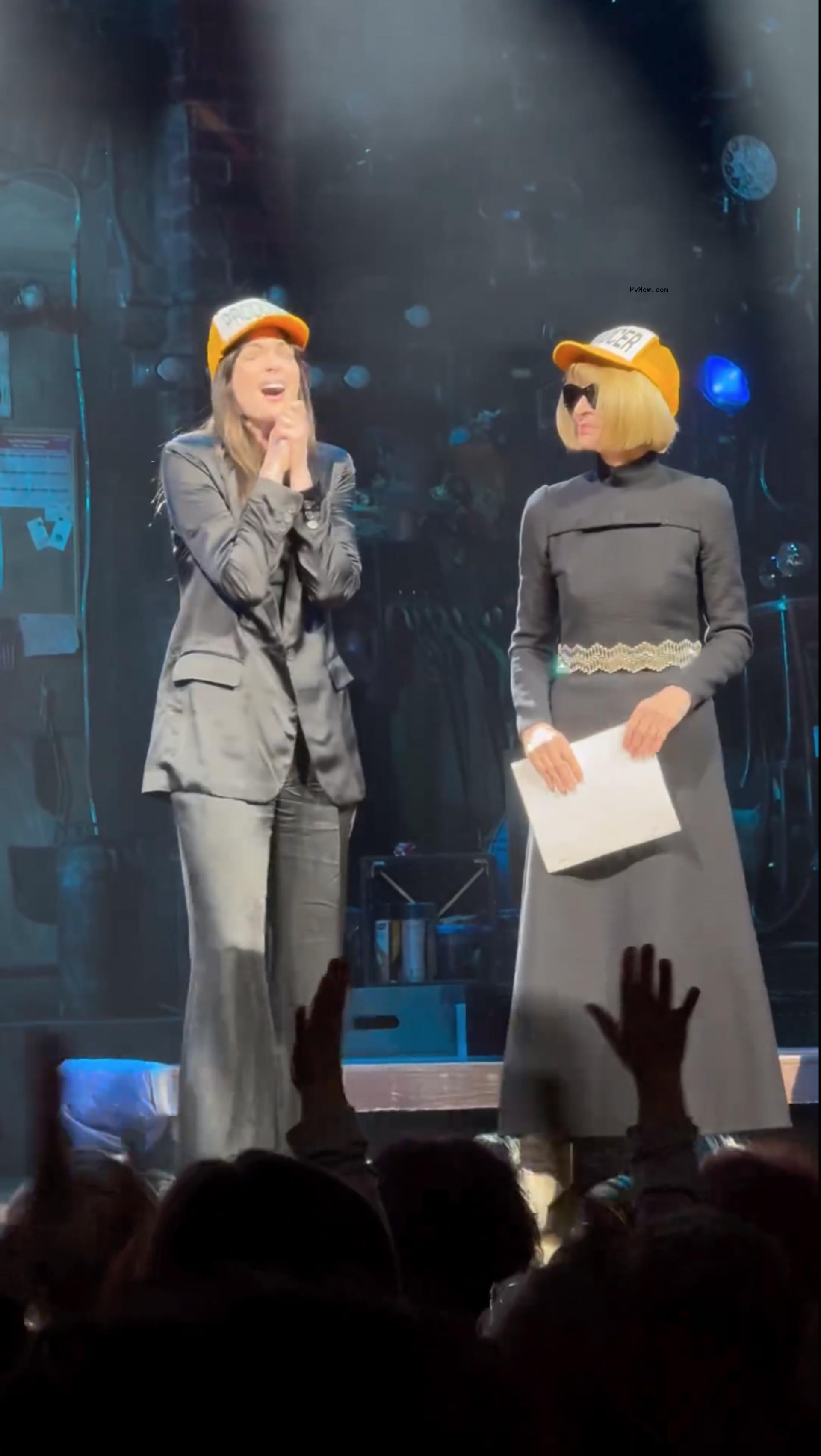 Anna Wintour and Anne Hathaway on stage at 