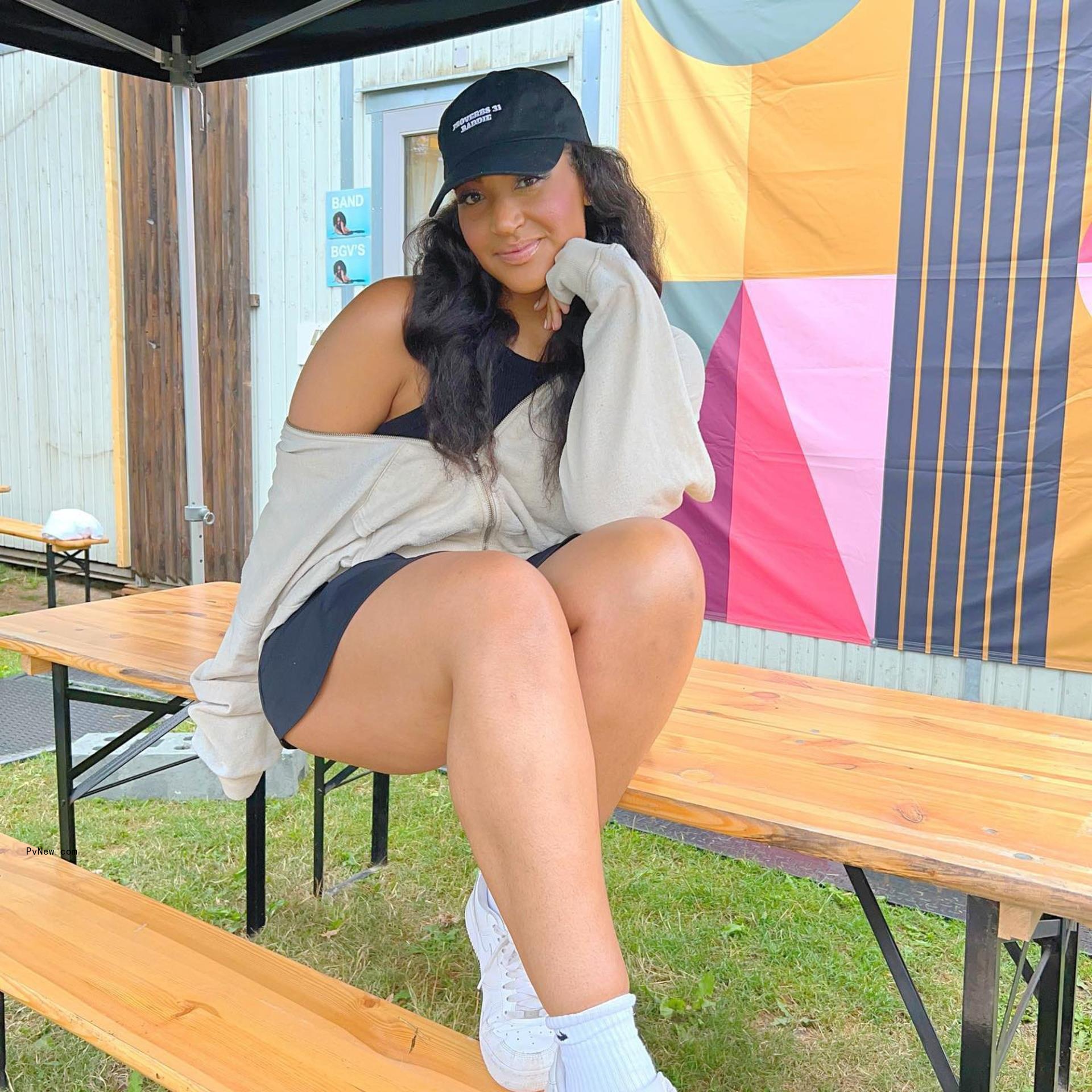 Shirlene Quigley sitting on a table.